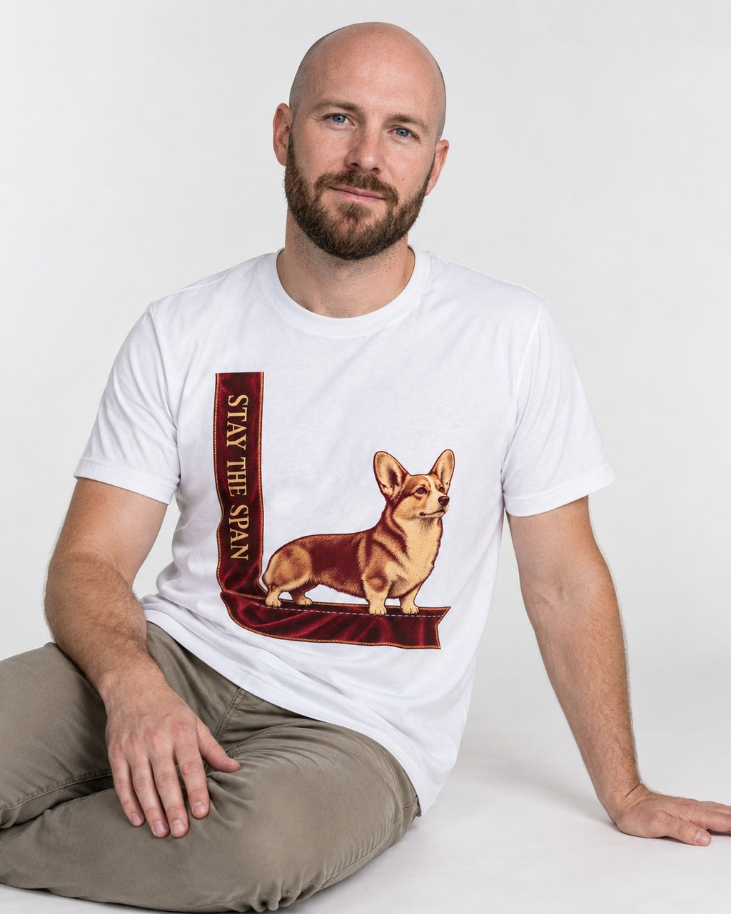 Corgi Stay the Span Ribbon T-Shirt in White, worn by a seated model