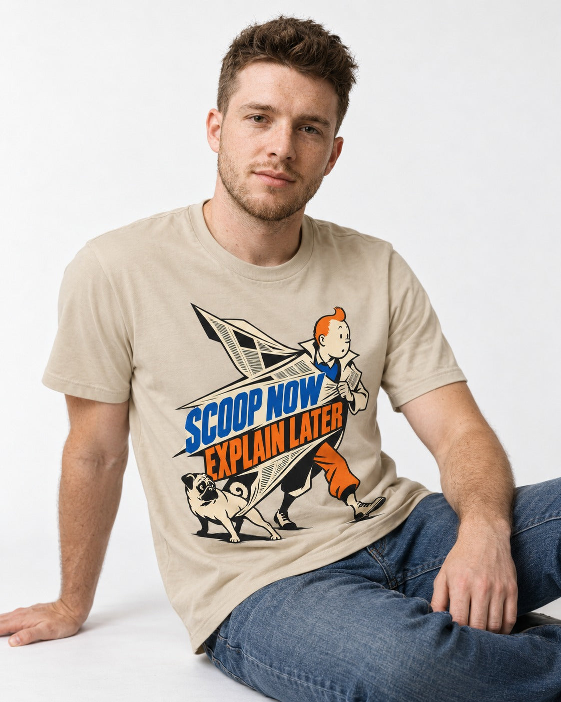 Pug Scoop Now Explain Later T-Shirt in Sand, worn by a seated model