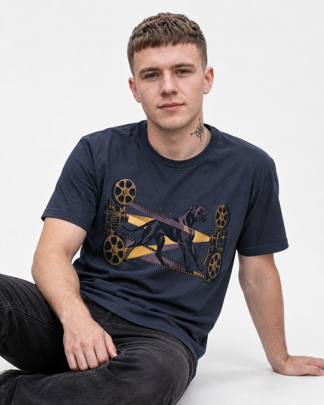 Light Never Waits Boxer Cinema Graphic T-Shirt in Navy, worn by a seated model