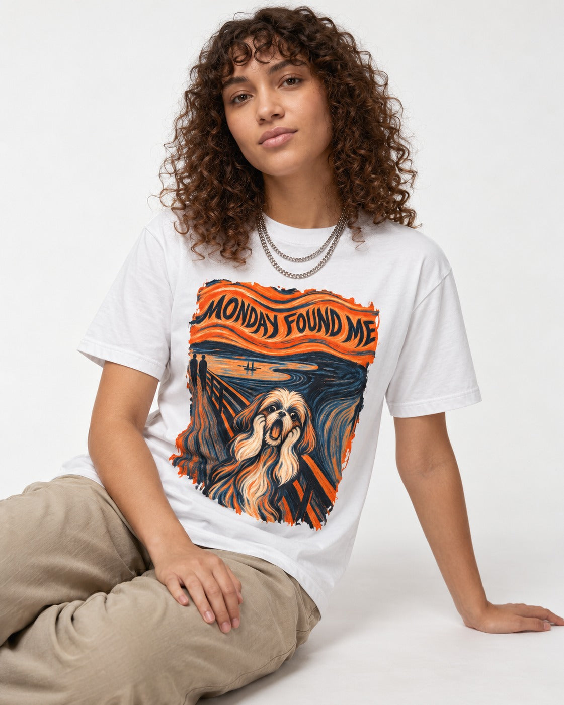 Shih Tzu Monday Found Me Scream Parody Graphic T-Shirt in White, worn by a seated model