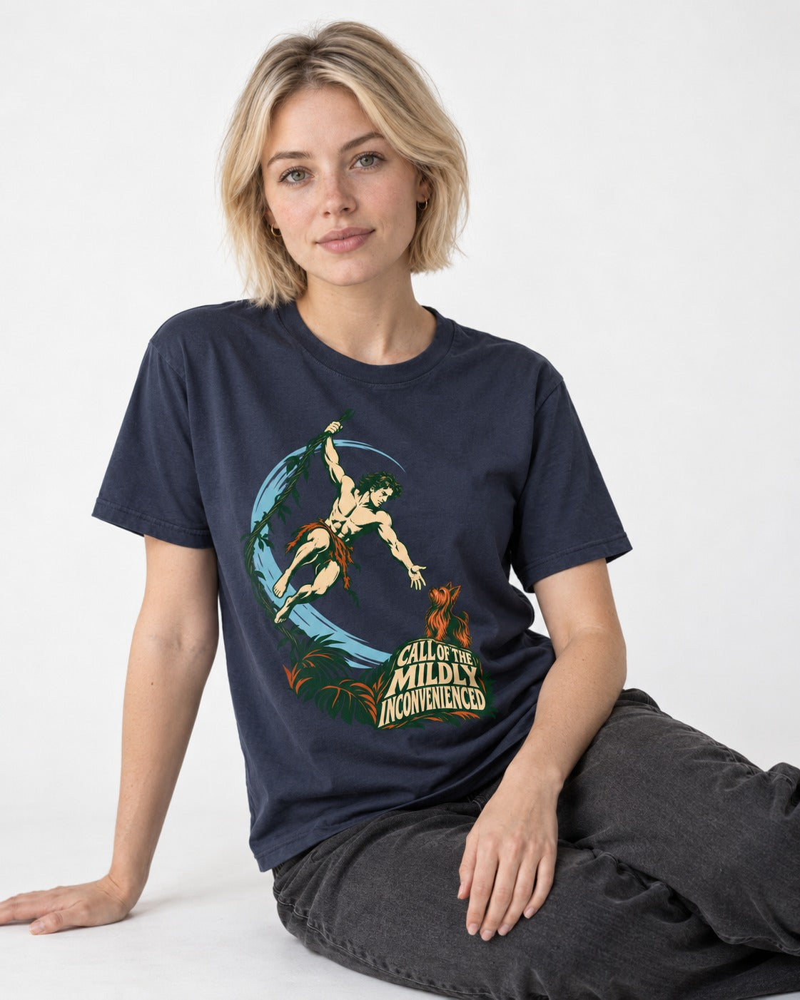 Yorkshire Terrier Call of the Mildly Inconvenienced Vine Swing Graphic T-Shirt in Navy, worn by a seated model