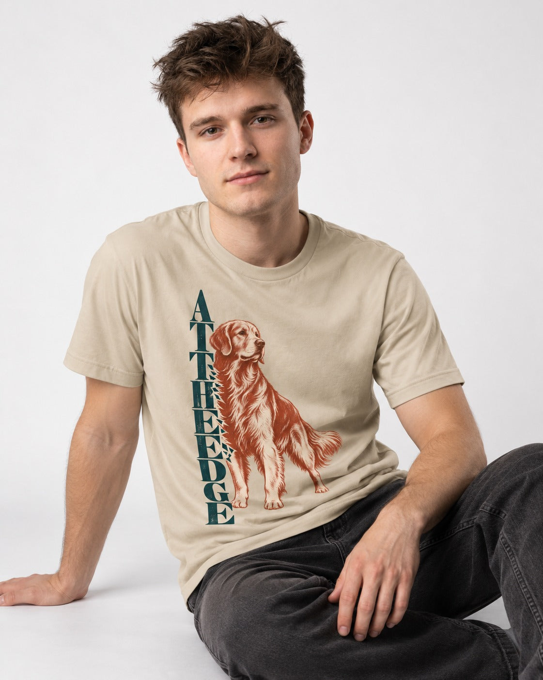 Golden Retriever At the Edge T-Shirt in Sand, worn by a seated model