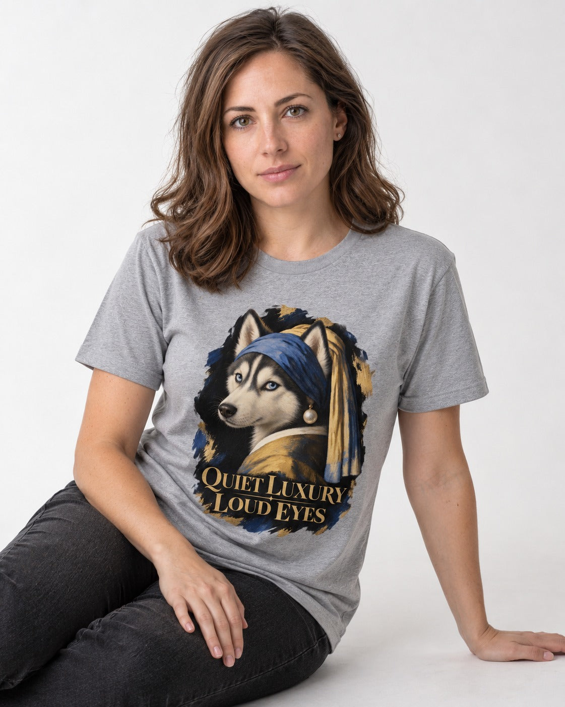 Husky Quiet Luxury Loud Eyes Pearl Portrait Graphic T-Shirt in Sport Grey, worn by a seated model