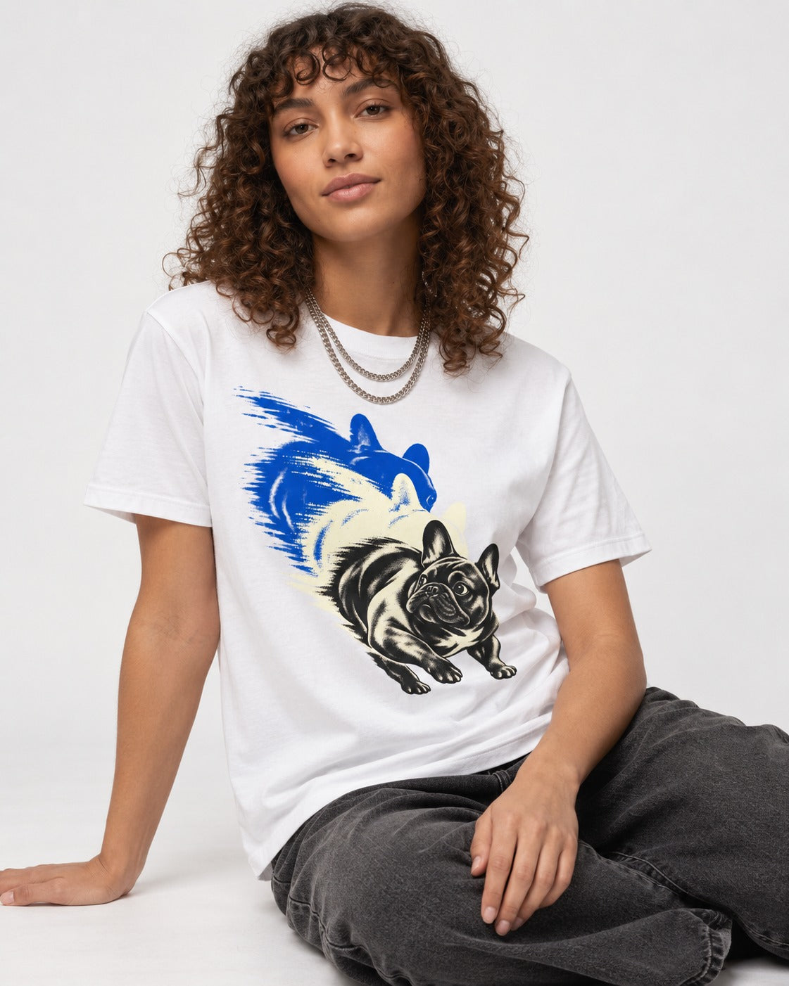 Frenchie Blue Brush Zoomie Graphic T-Shirt in White, worn by a seated model