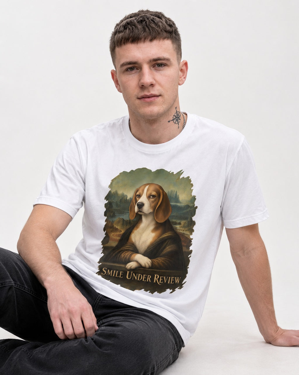 Smile Under Review Beagle Portrait T-Shirt in White, worn by a seated model
