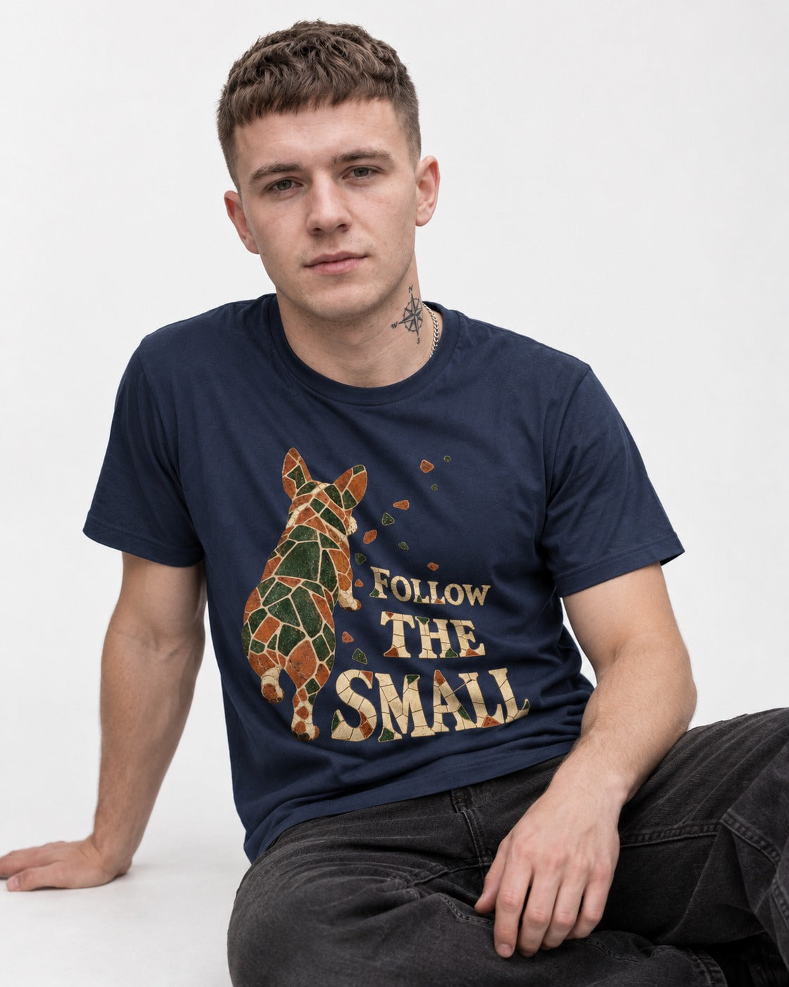 Corgi Follow the Small Mosaic T-Shirt in Navy, worn by a seated model