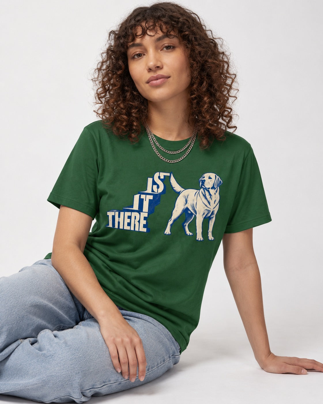 Labrador Retriever Is It There Stair-Step Graphic T-Shirt in Forest Green, worn by a seated model