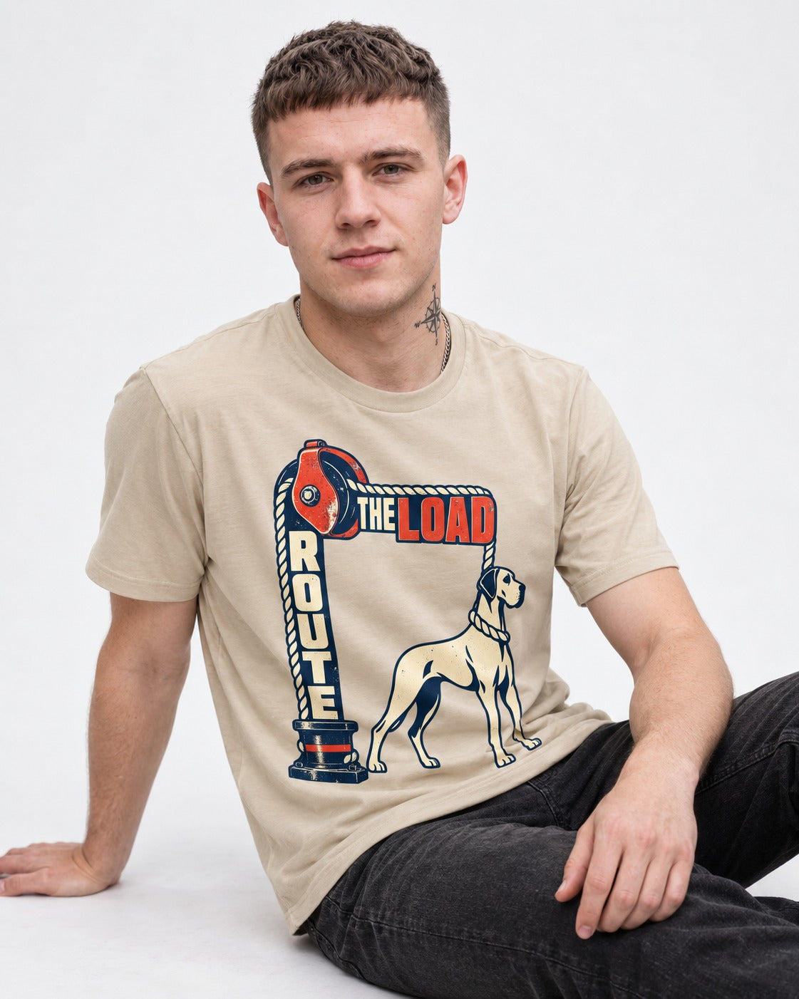 Great Dane Route the Load T-Shirt in Sand, worn by a seated model
