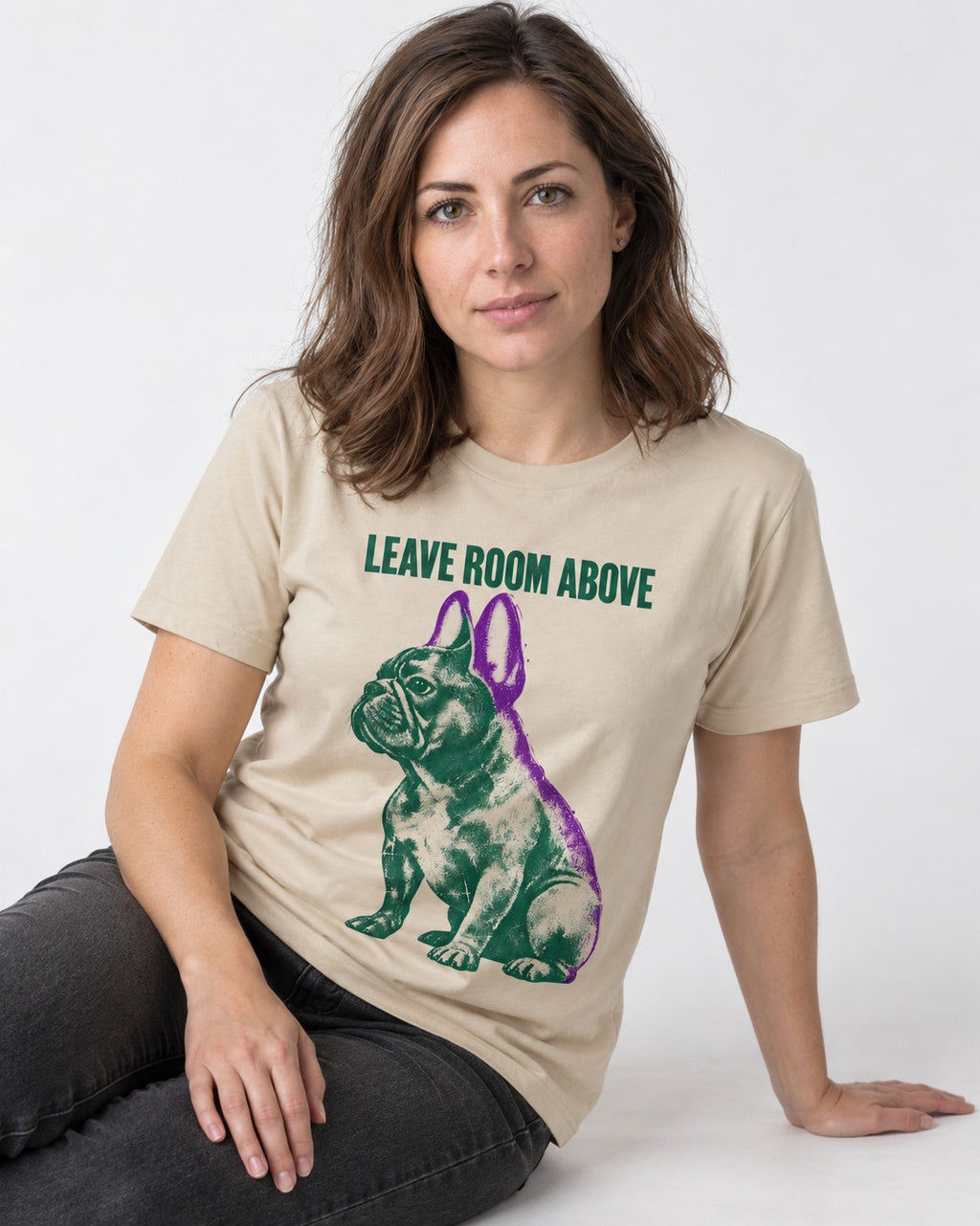 Leave Room Above Frenchie T-Shirt in Sand, worn by a seated model