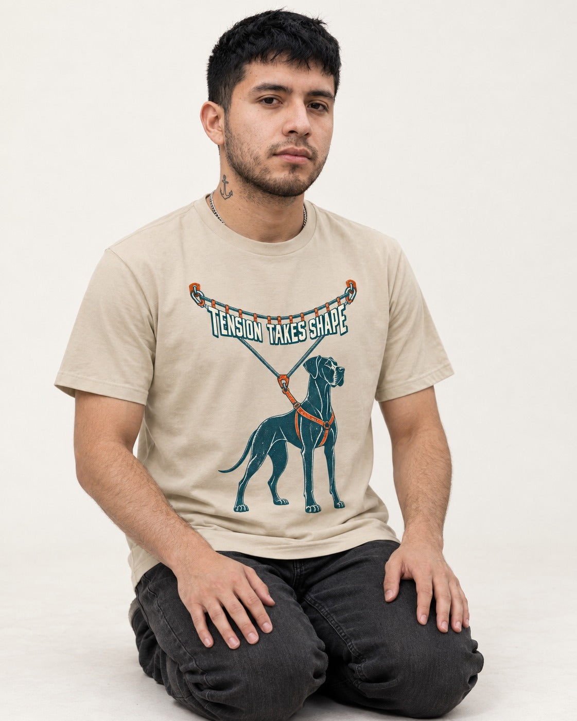 Great Dane Tension Takes Shape T-Shirt in Sand, worn by a seated model