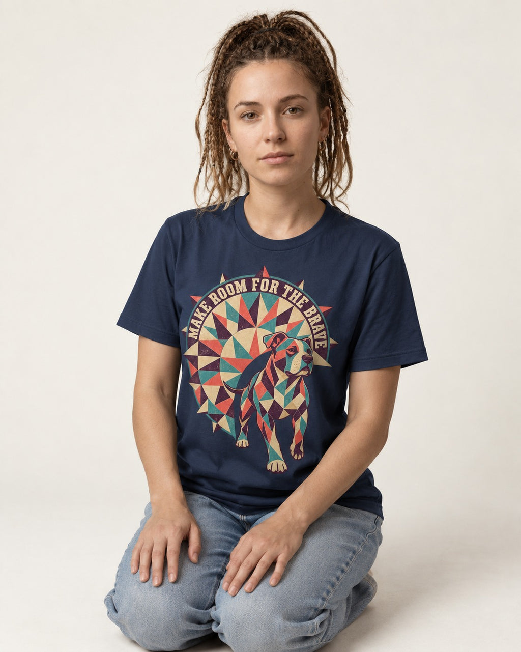 Pitbull Make Room for the Brave Mosaic Graphic T-Shirt in Navy, worn by a seated model