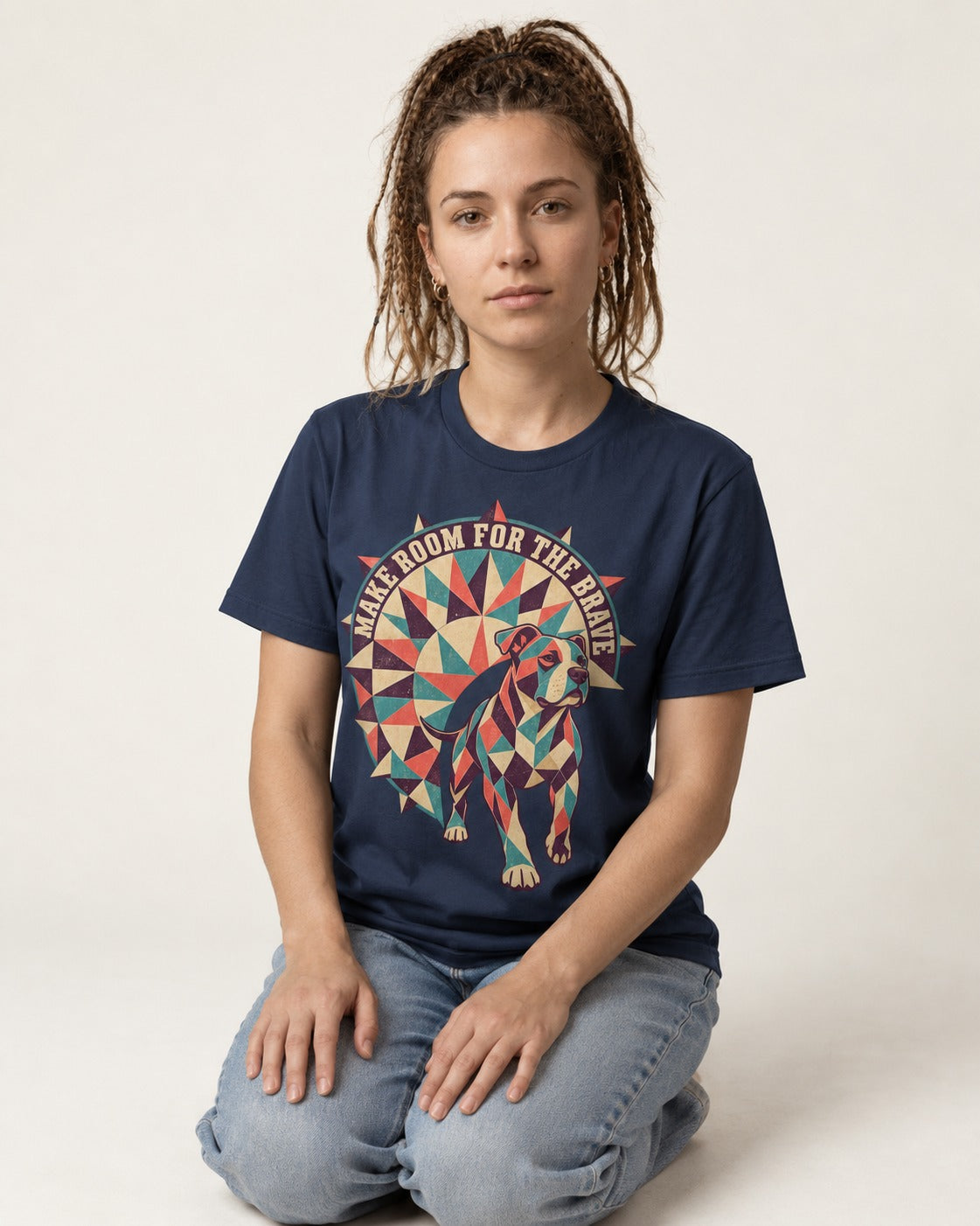Pitbull Make Room for the Brave Mosaic Graphic T-Shirt in Navy, worn by a seated model