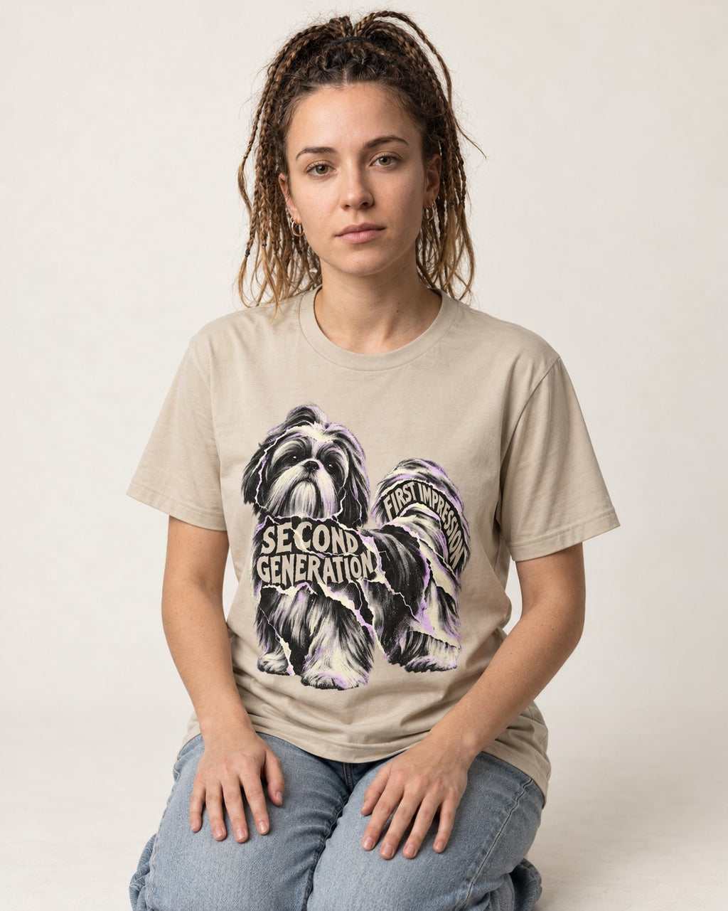 Second Generation Shih Tzu T-Shirt in Sand, worn by a seated model