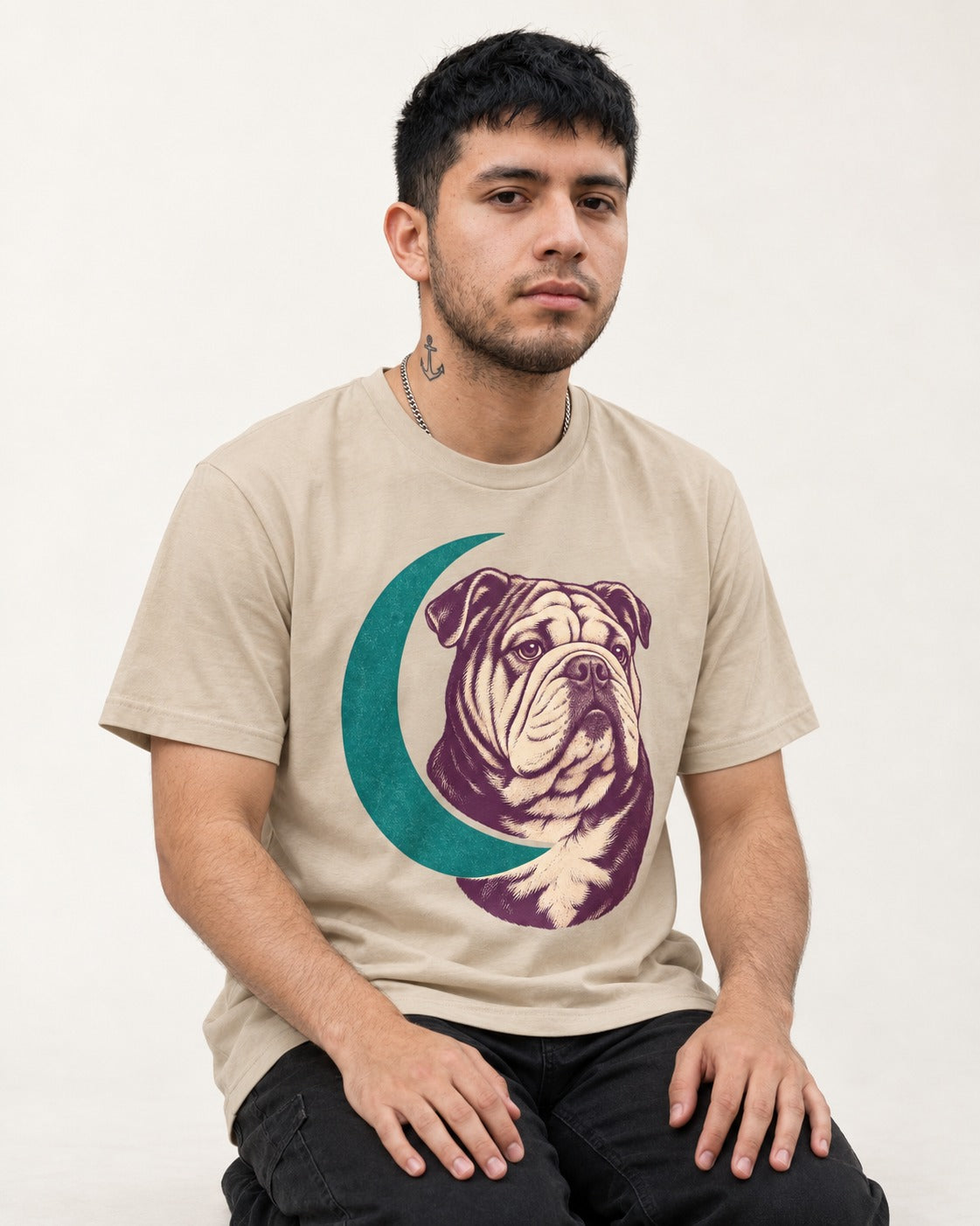 Moonstruck English Bulldog T-Shirt in Sand, worn by a seated model