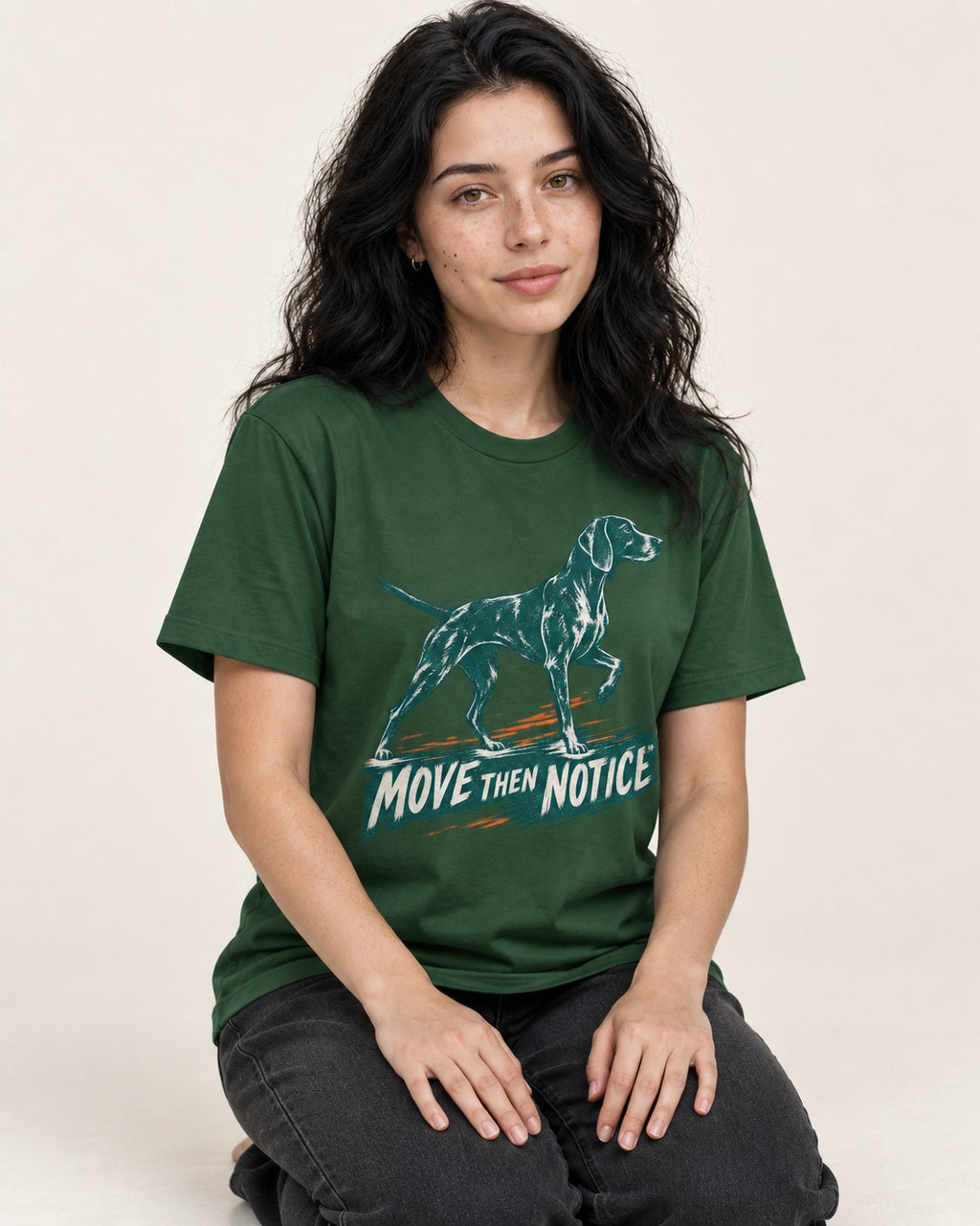 German Shorthaired Pointer Move Then Notice Brushstroke Graphic T-Shirt in Forest Green, worn by a seated model