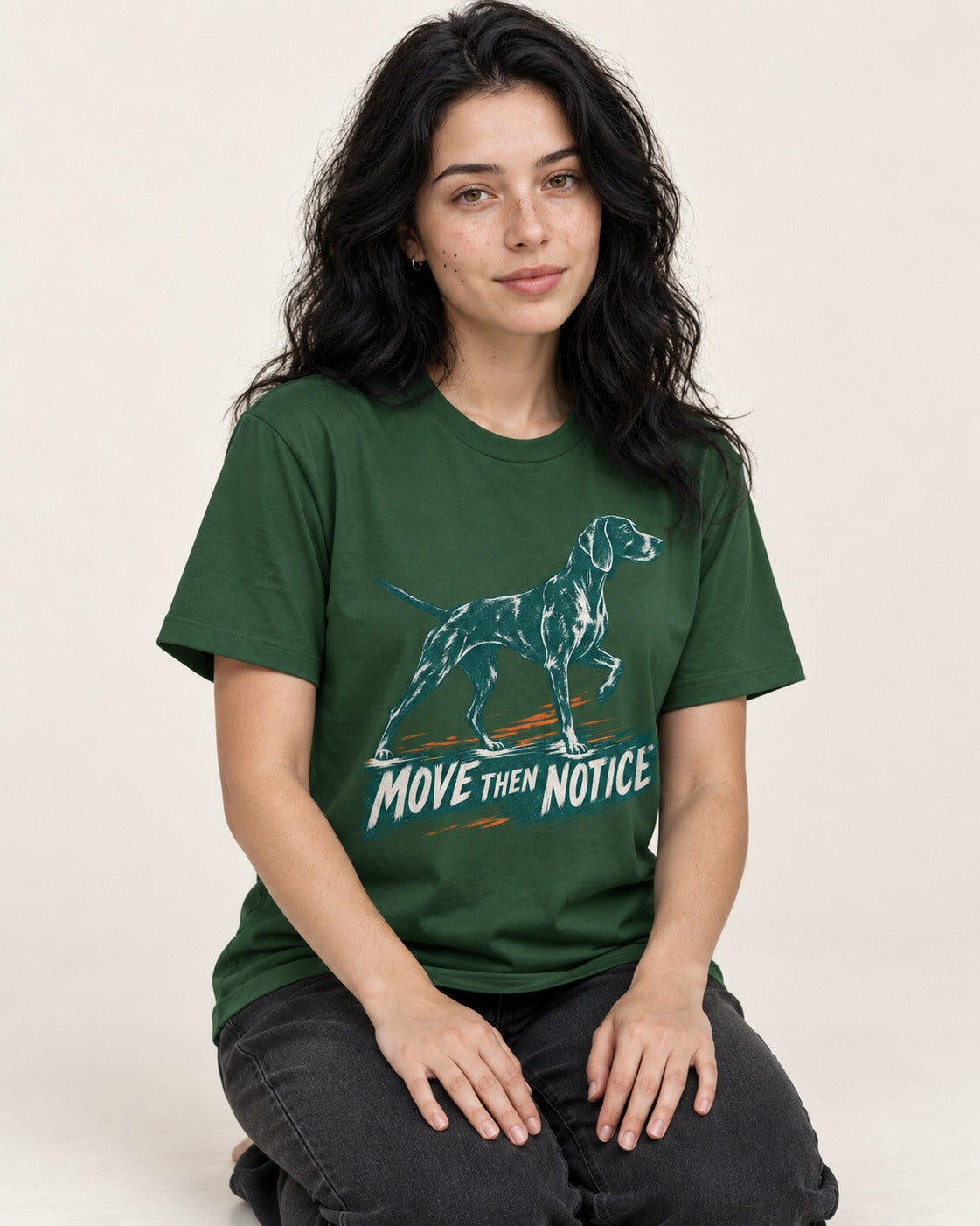 German Shorthaired Pointer Move Then Notice Brushstroke Graphic T-Shirt in Forest Green, worn by a seated model