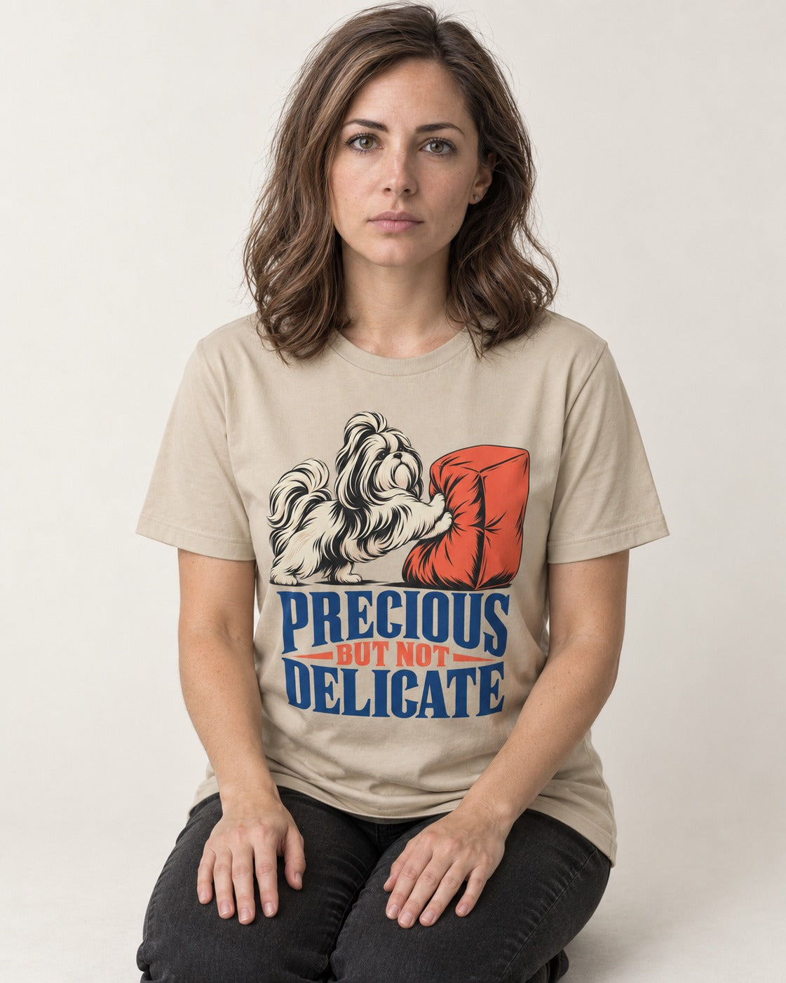 Precious but Not Delicate Shih Tzu T-Shirt in Sand, worn by a seated model