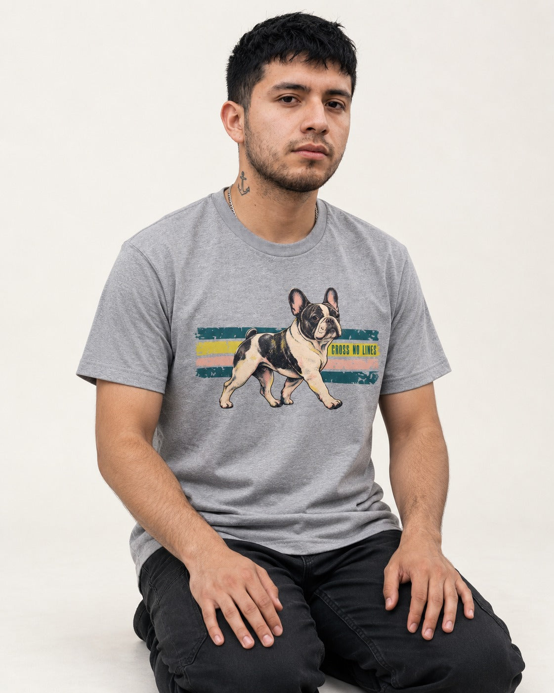 Frenchie Cross No Lines T-Shirt in Sport Grey, worn by a seated model