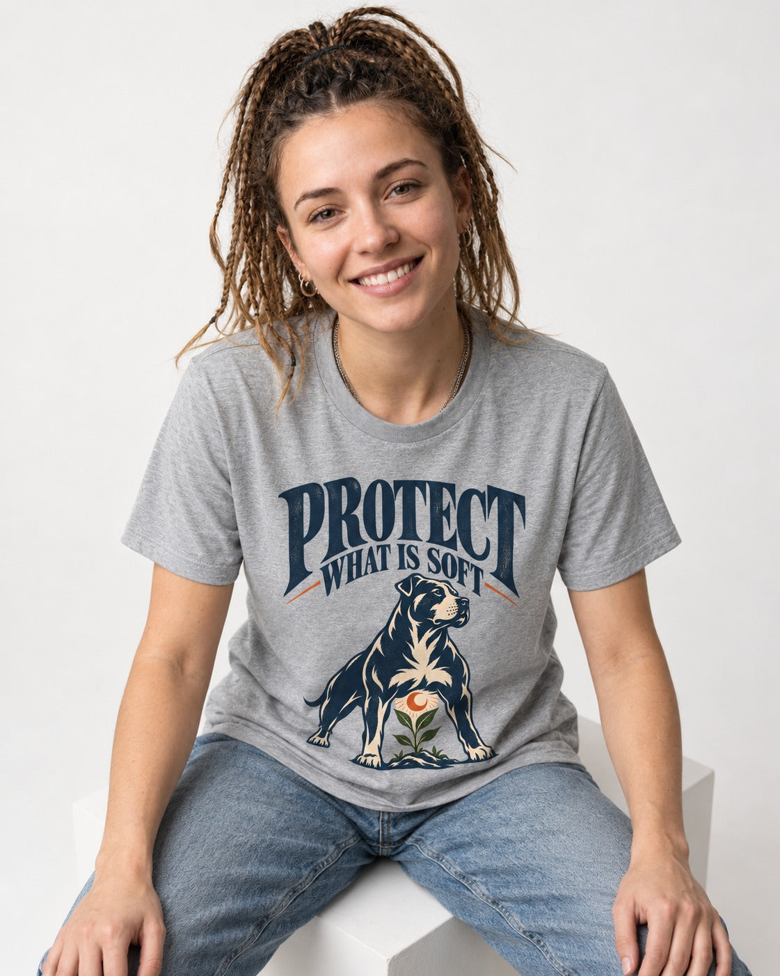 Protect What Is Soft Pitbull T-Shirt in Sport Grey, worn by a seated model