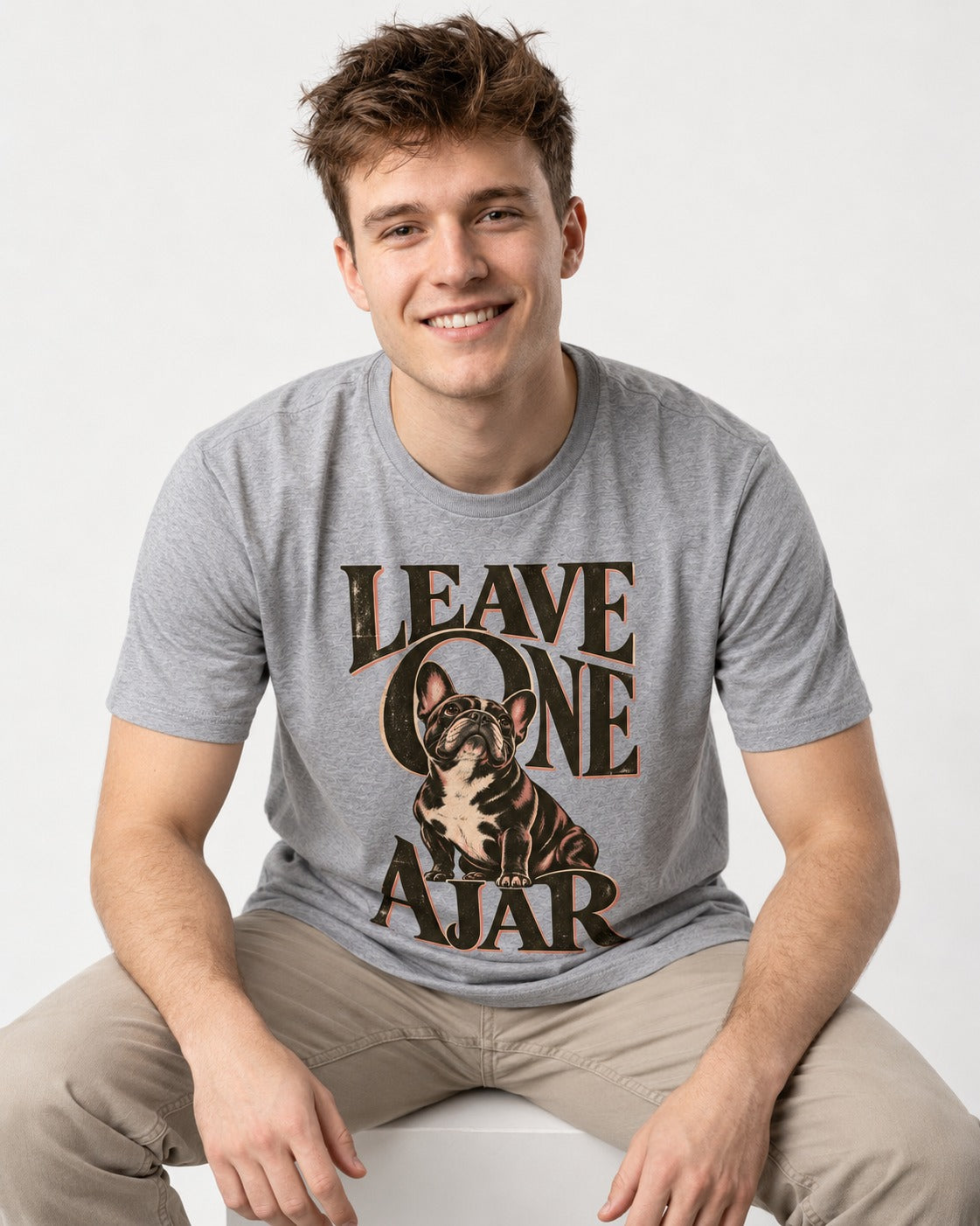 Leave One Ajar for Frenchie T-Shirt in Sport Grey, worn by a seated model