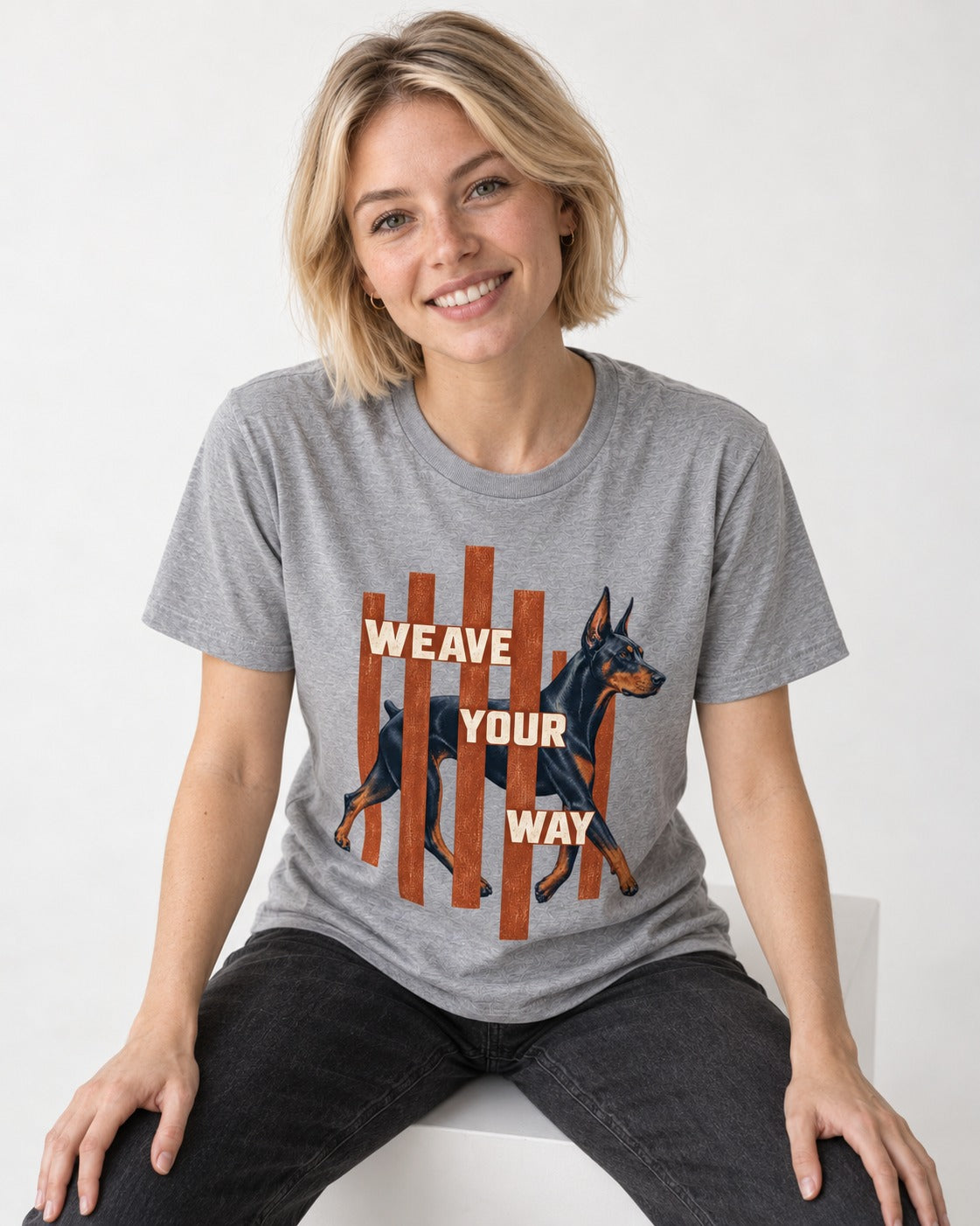Weave Your Way Doberman T-Shirt in Sport Grey, worn by a seated model