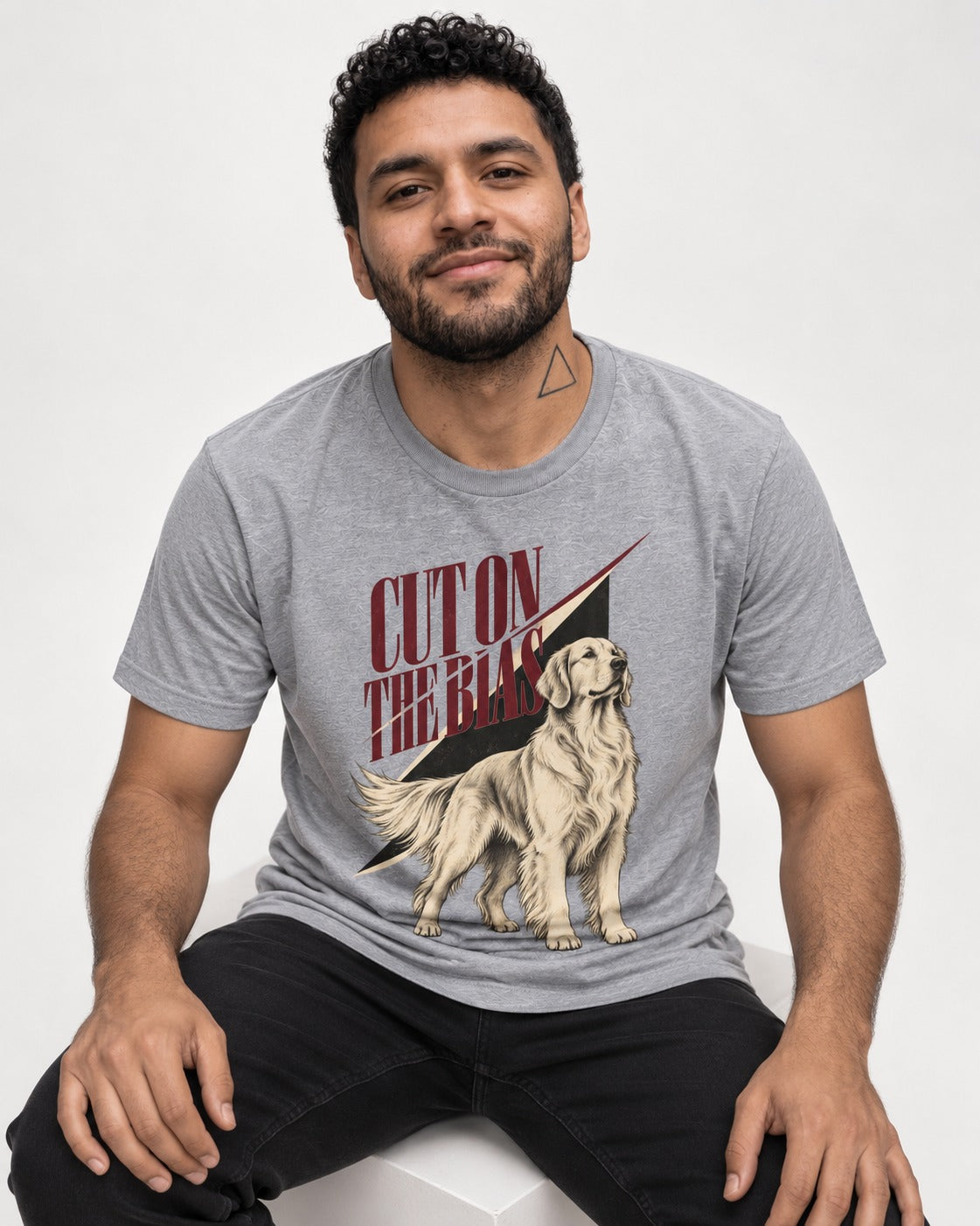 Cut on the Bias Golden Retriever T-Shirt in Sport Grey, worn by a seated model