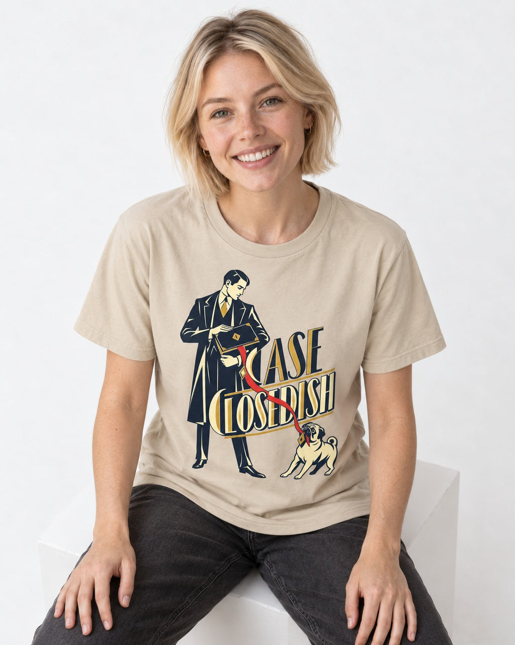 Case Closedish Pug T-Shirt in Sand, worn by a seated model