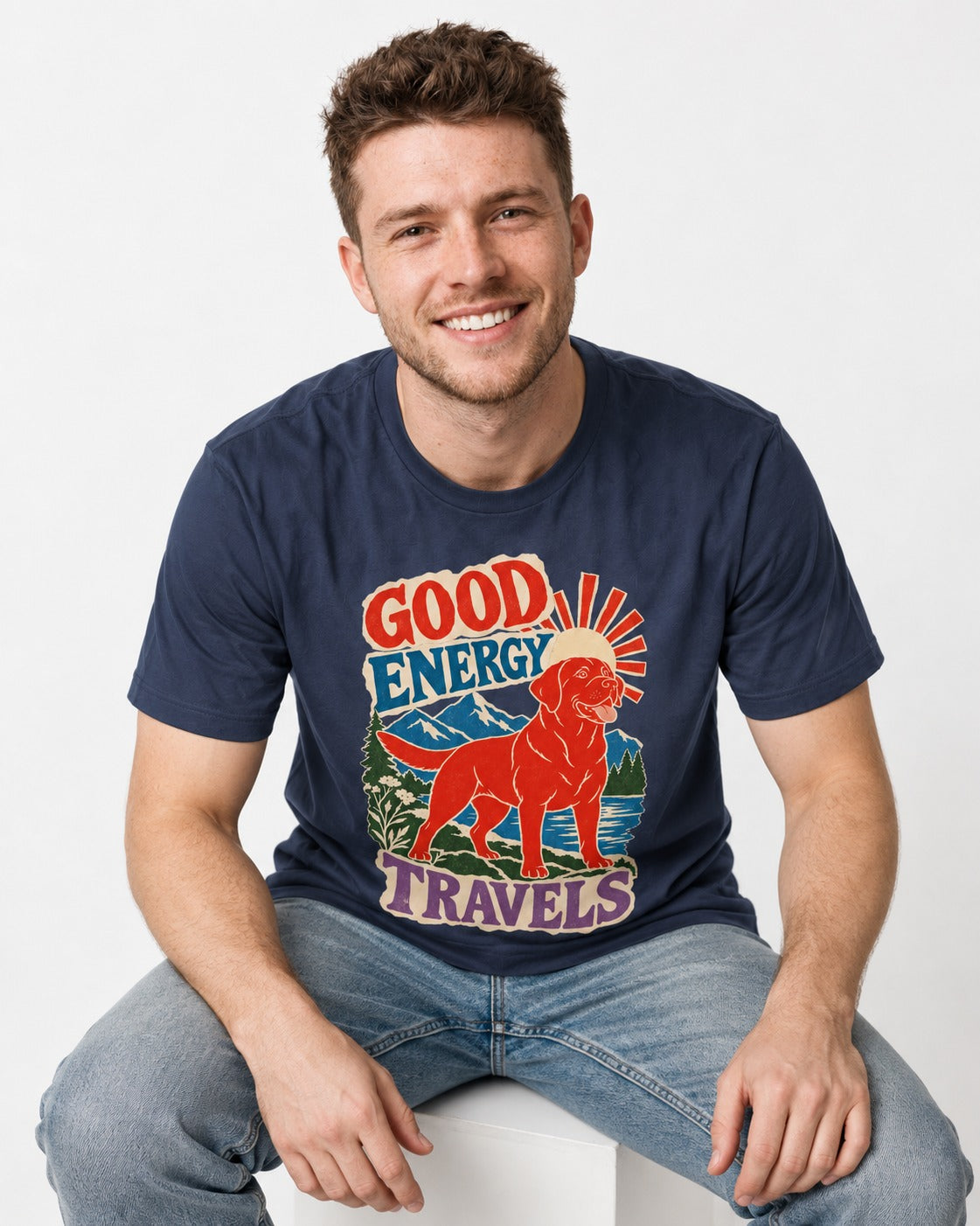 Labrador Retriever Good Energy Travels Adventure Graphic T-Shirt in Navy, worn by a seated model