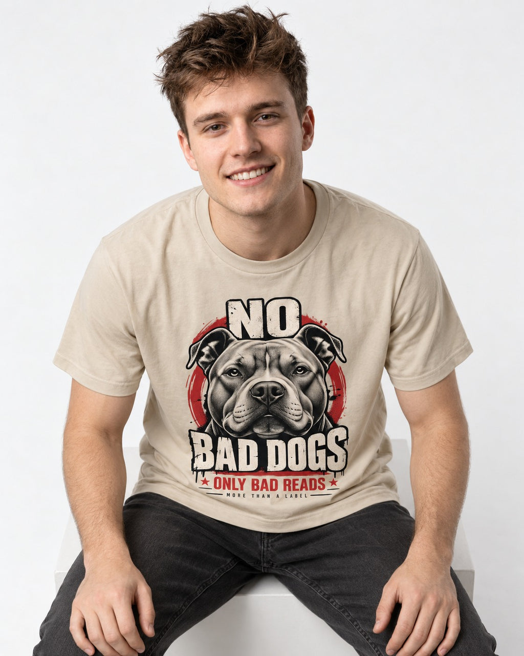 Pitbull Only Bad Reads T-Shirt in Sand, worn by a seated model