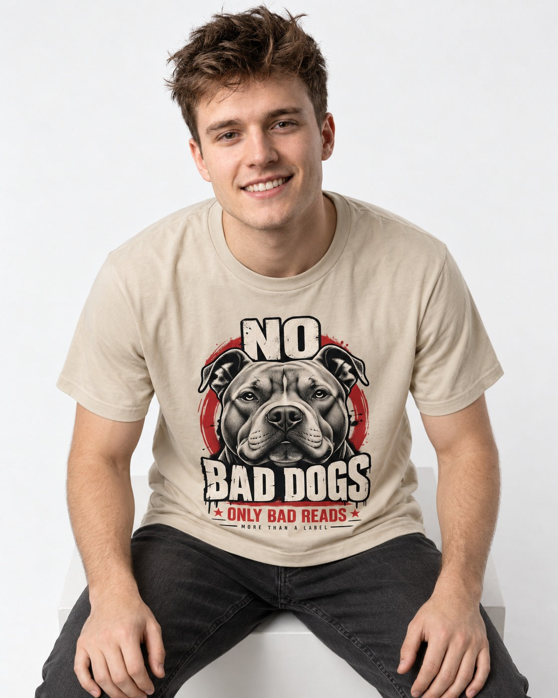Pitbull Only Bad Reads T-Shirt in Sand, worn by a seated model