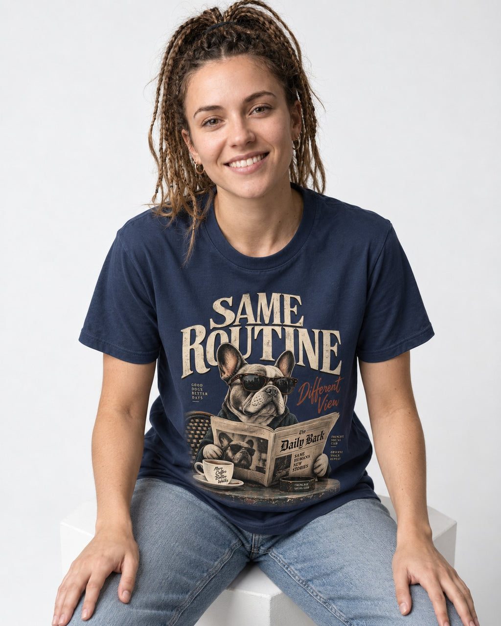 Frenchie Same Routine Different View Graphic T-Shirt in Navy, worn by a seated model