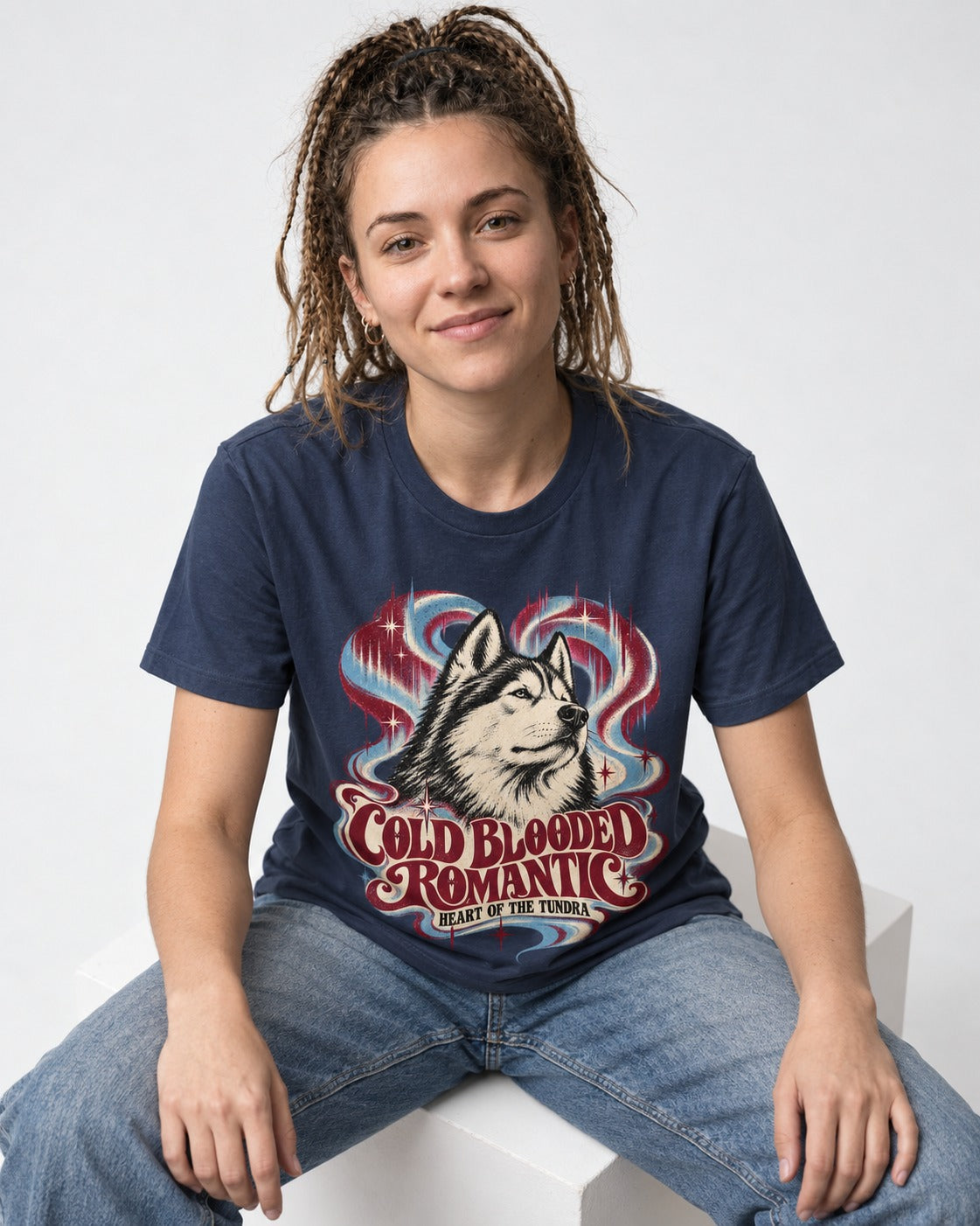 Husky Cold Blooded Romantic Heart of the Tundra Graphic T-Shirt in Navy, worn by a seated model