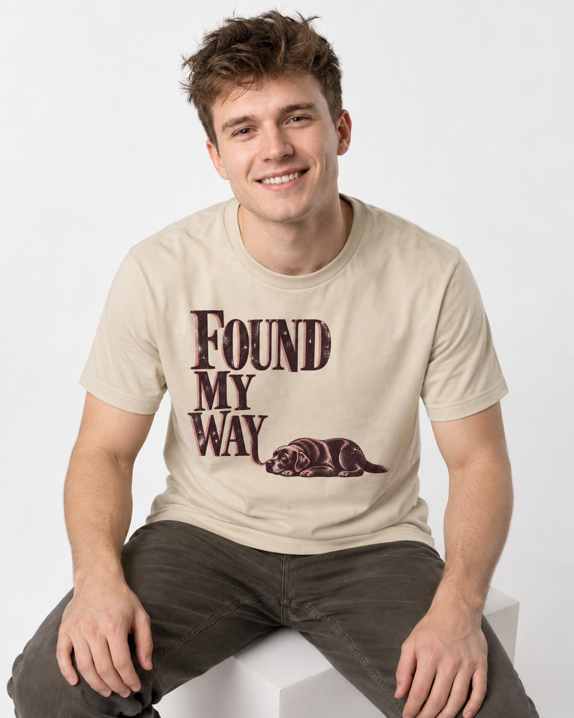 Found My Way Labrador Retriever T-Shirt in Sand, worn by a seated model