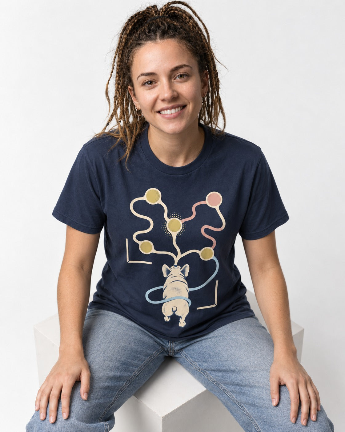 Frenchie Scent Circuit Rear View Graphic T-Shirt in Navy, worn by a seated model