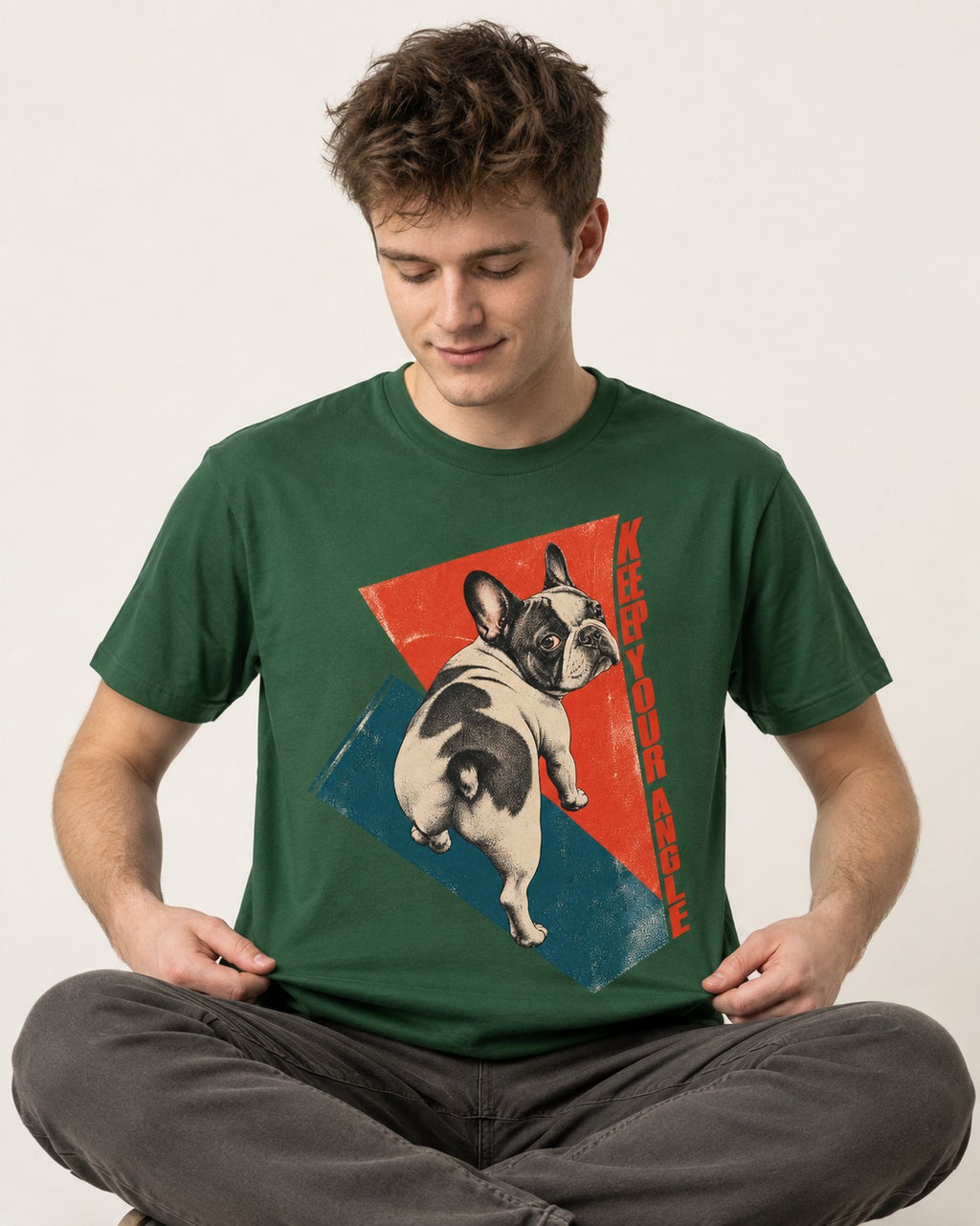Frenchie Keep Your Angle Geometric Graphic T-Shirt in Forest Green, worn by a seated model