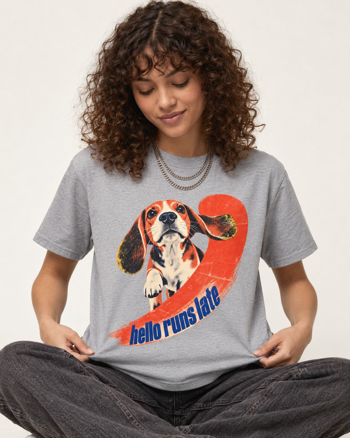 Beagle Hello Runs Late T-Shirt in Sport Grey, worn by a seated model