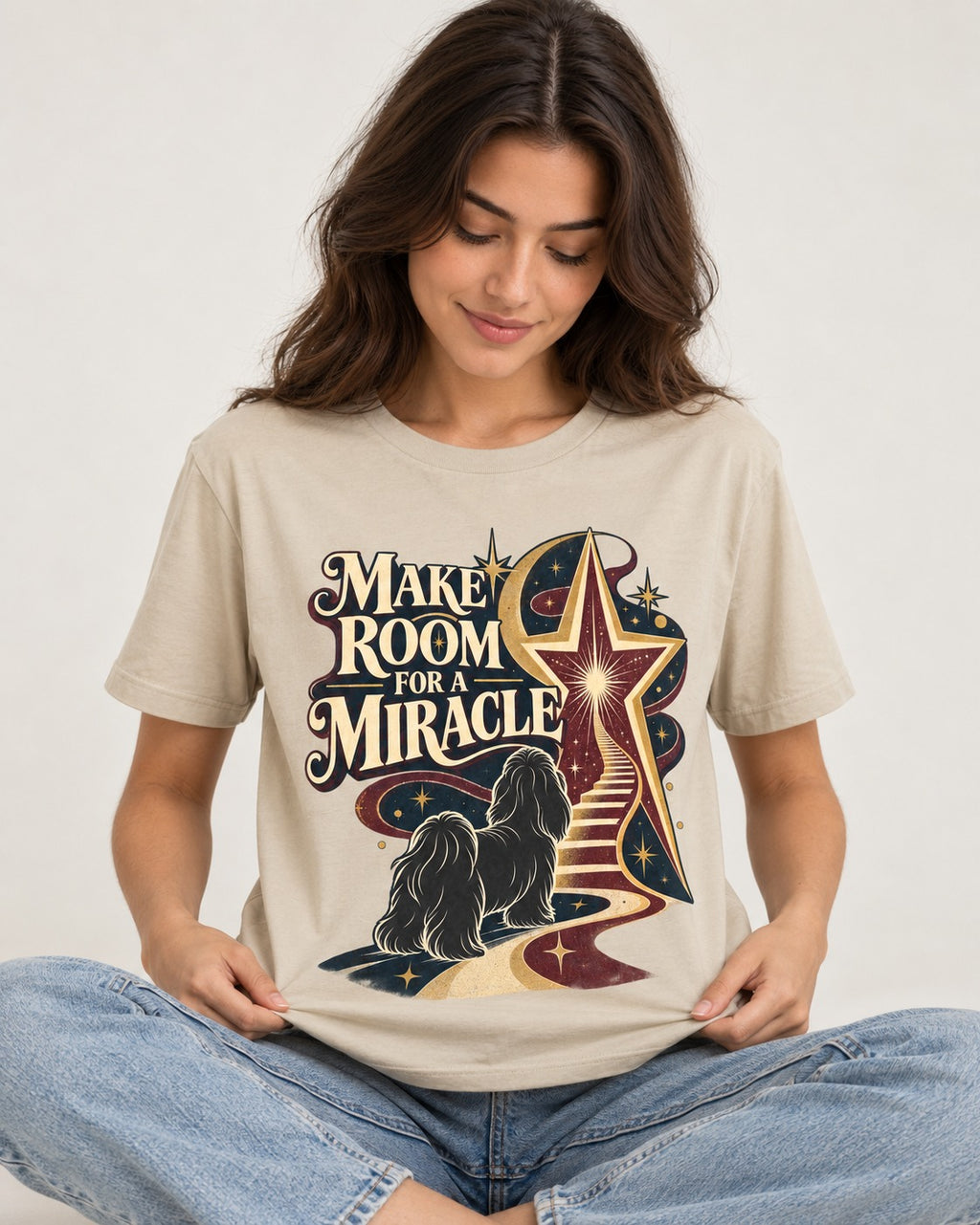Room for a Shih Tzu Miracle T-Shirt in Sand, worn by a seated model
