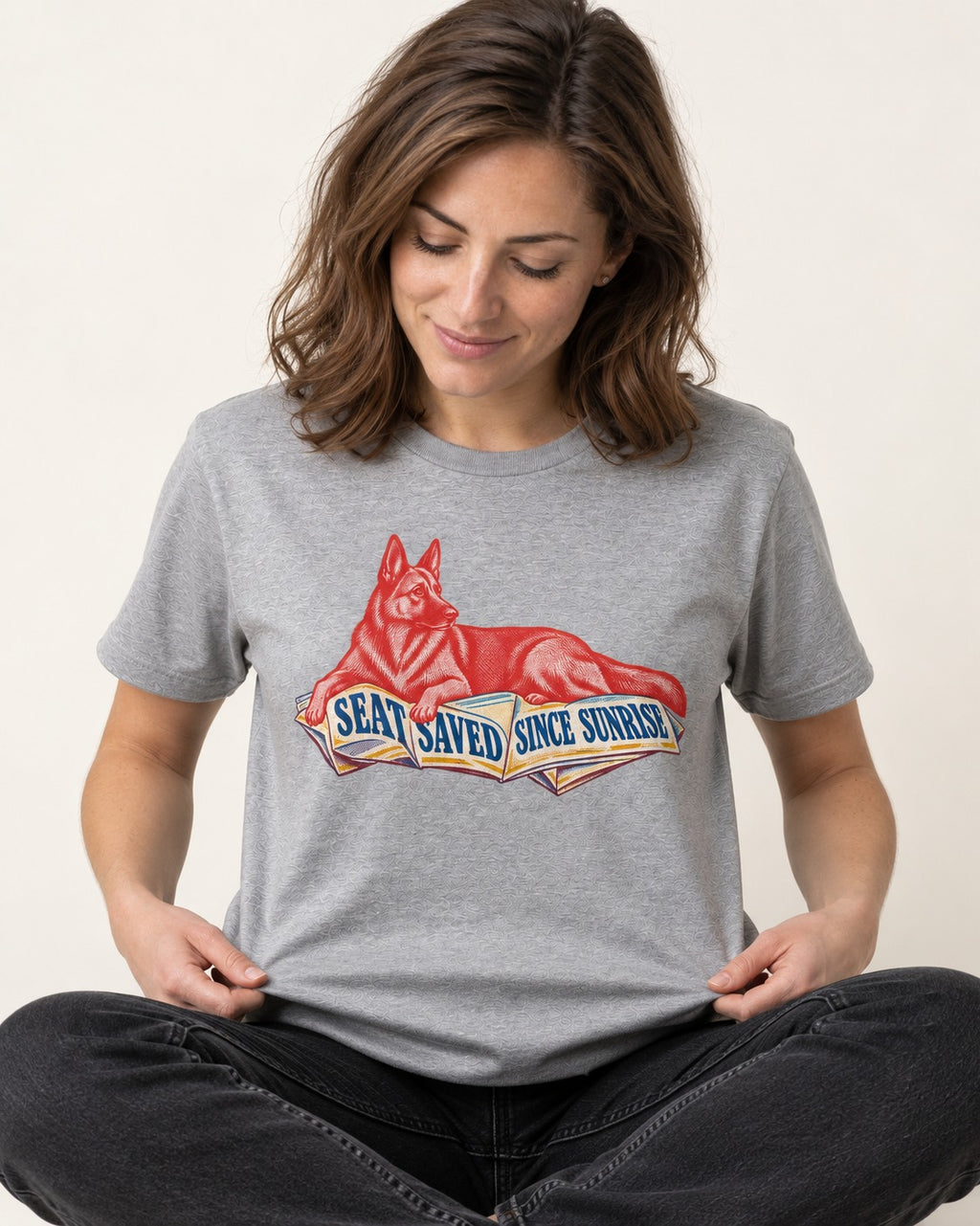 Seat Saved Since Sunrise German Shepherd Dog T-Shirt in Sport Grey, worn by a seated model