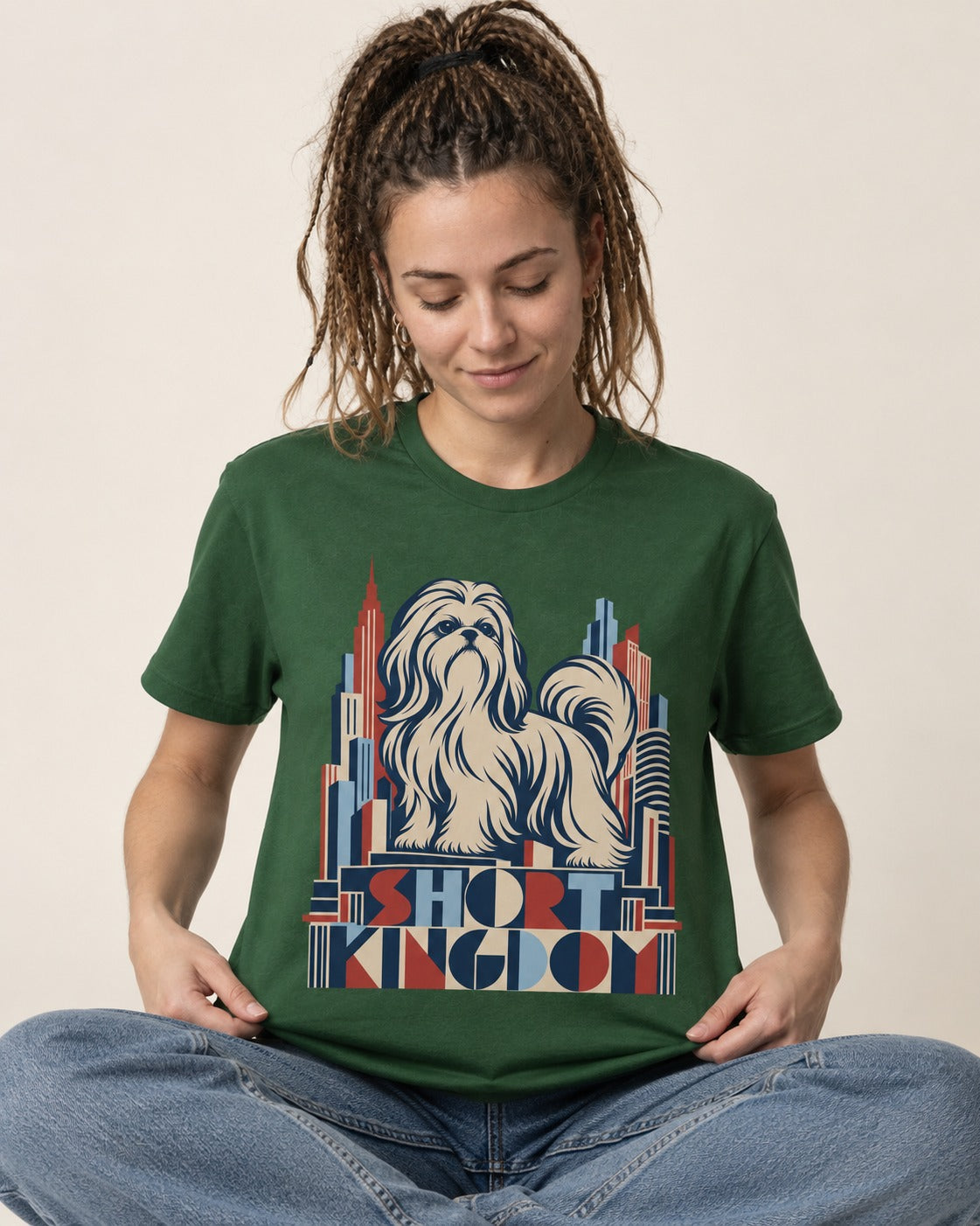 Shih Tzu Short Kingdom Art Deco Skyline Graphic T-Shirt in Forest Green, worn by a seated model