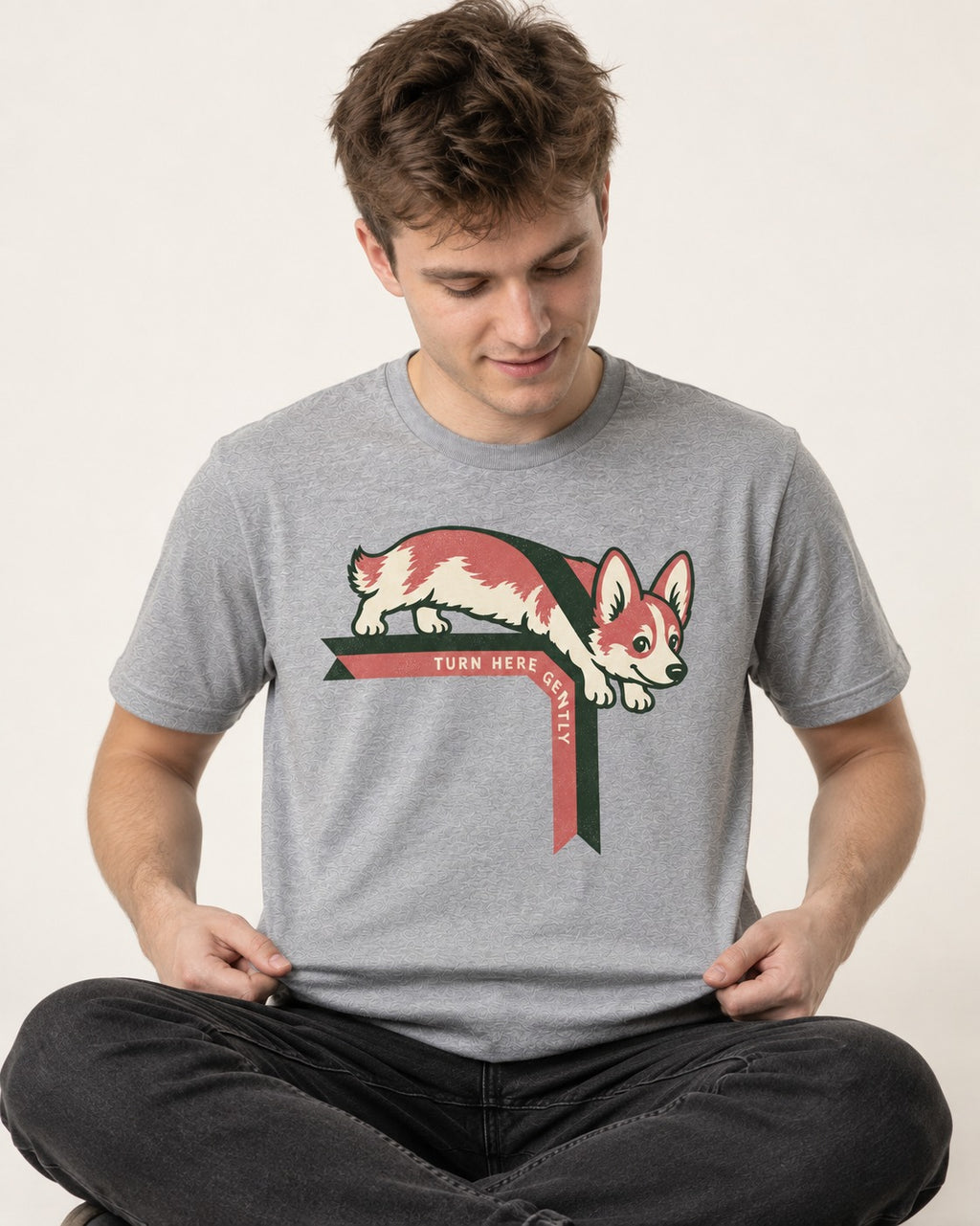 Corgi Turn Here Gently T-Shirt in Sport Grey, worn by a seated model