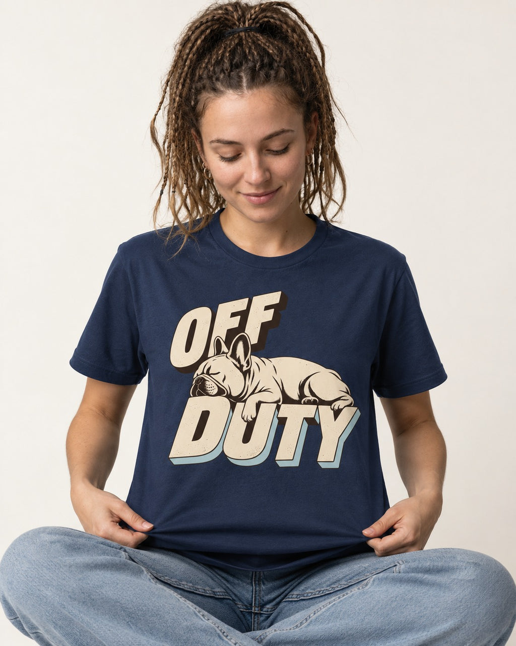 Frenchie Off Duty Sleeping Type Graphic T-Shirt in Navy, worn by a seated model