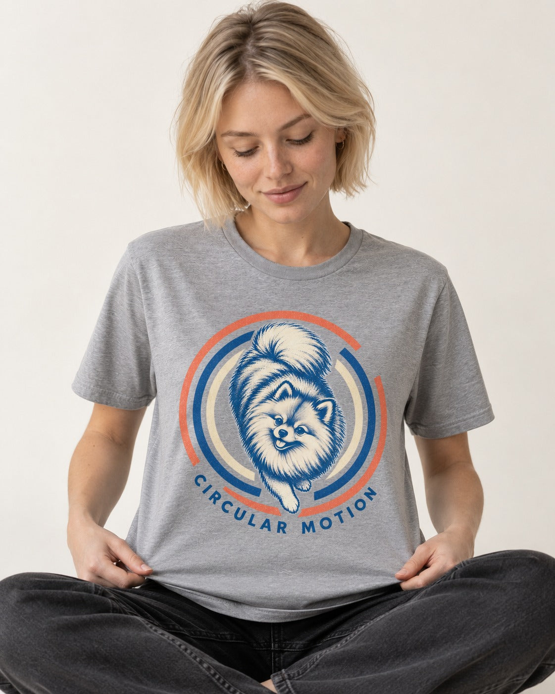 Pomeranian Circular Motion T-Shirt in Sport Grey, worn by a seated model