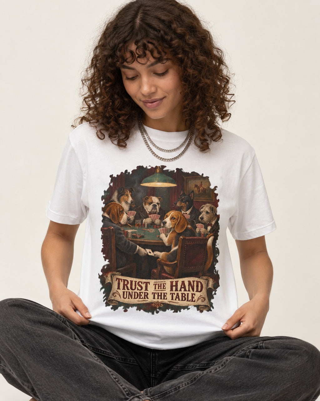 Trust The Hand Under The Table Beagle Poker Night T-Shirt in White, worn by a seated model