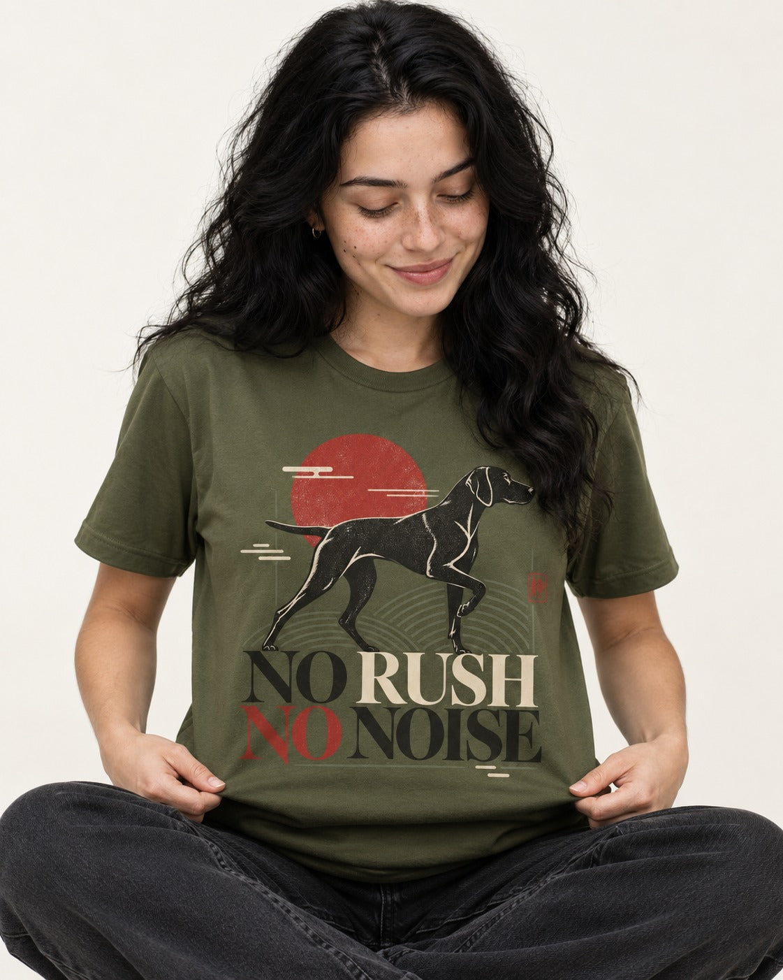 German Shorthaired Pointer No Rush No Noise Sunset Graphic T-Shirt in Heather Military Green, worn by a seated model