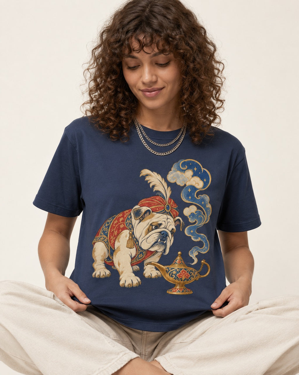 English Bulldog Magic Lamp Genie Graphic T-Shirt in Navy, worn by a seated model