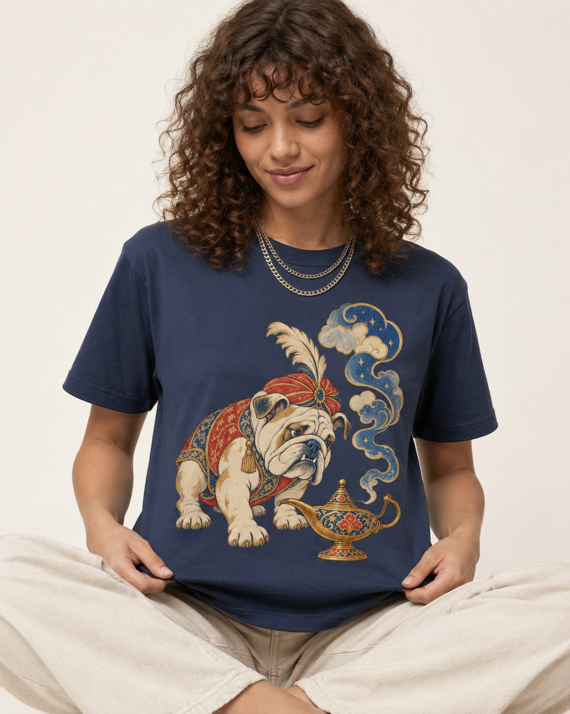 English Bulldog Magic Lamp Genie Graphic T-Shirt in Navy, worn by a seated model