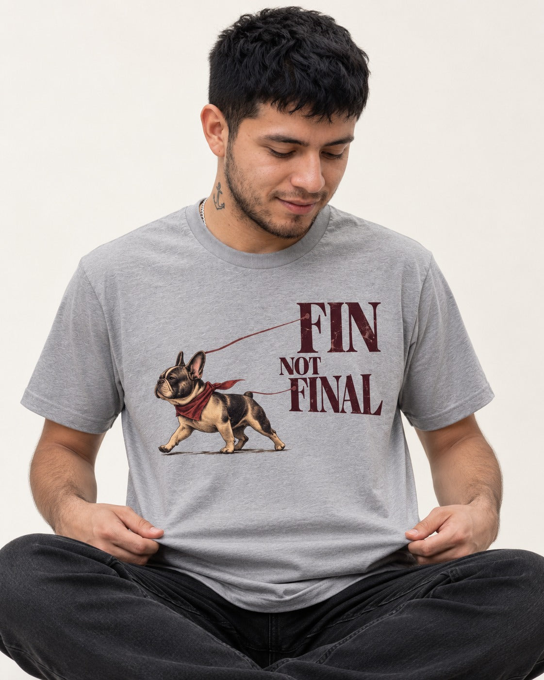 Frenchie Fin Not Final T-Shirt in Sport Grey, worn by a seated model
