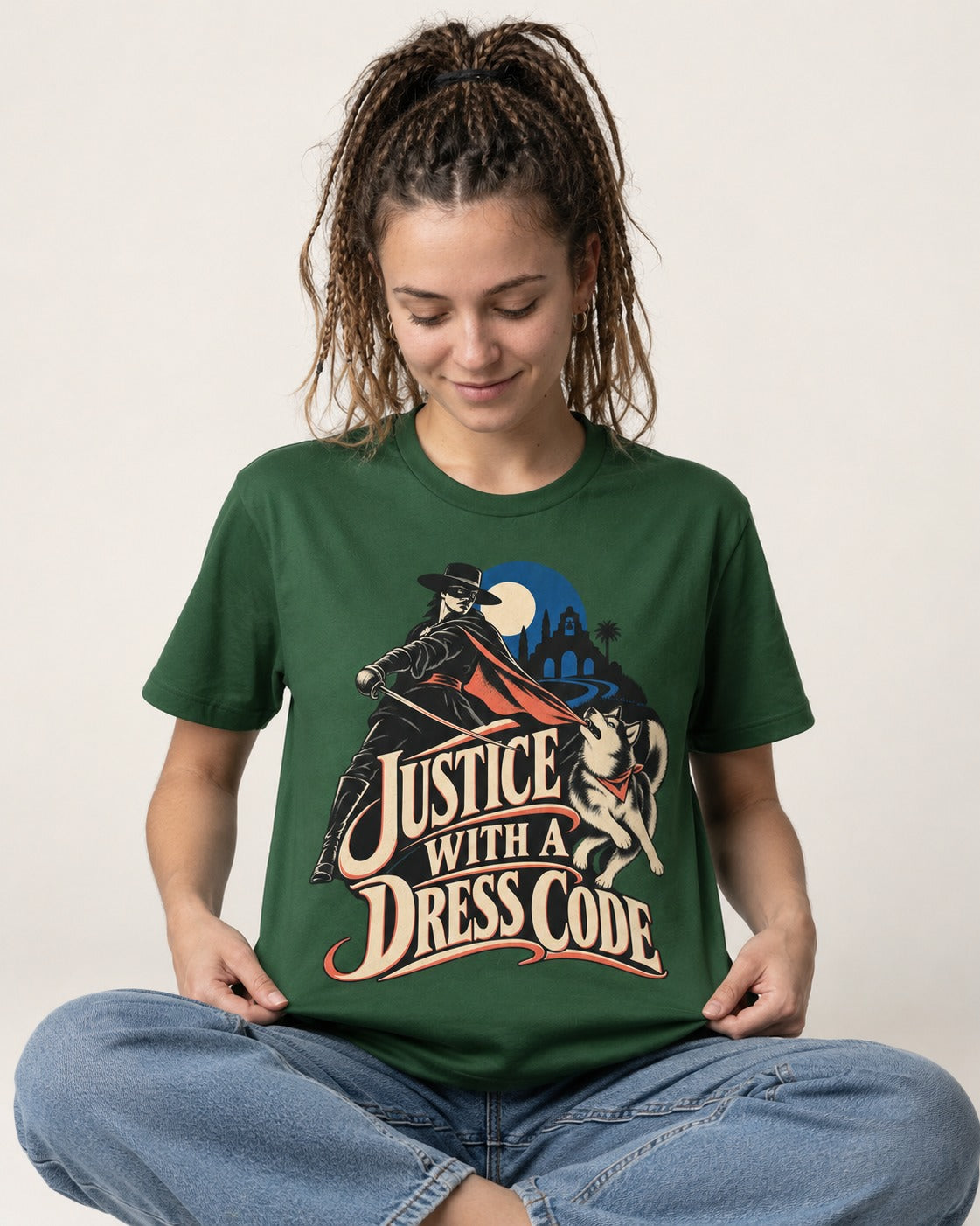 Husky Justice With A Dress Code Masked Swordsman Graphic T-Shirt in Forest Green, worn by a seated model