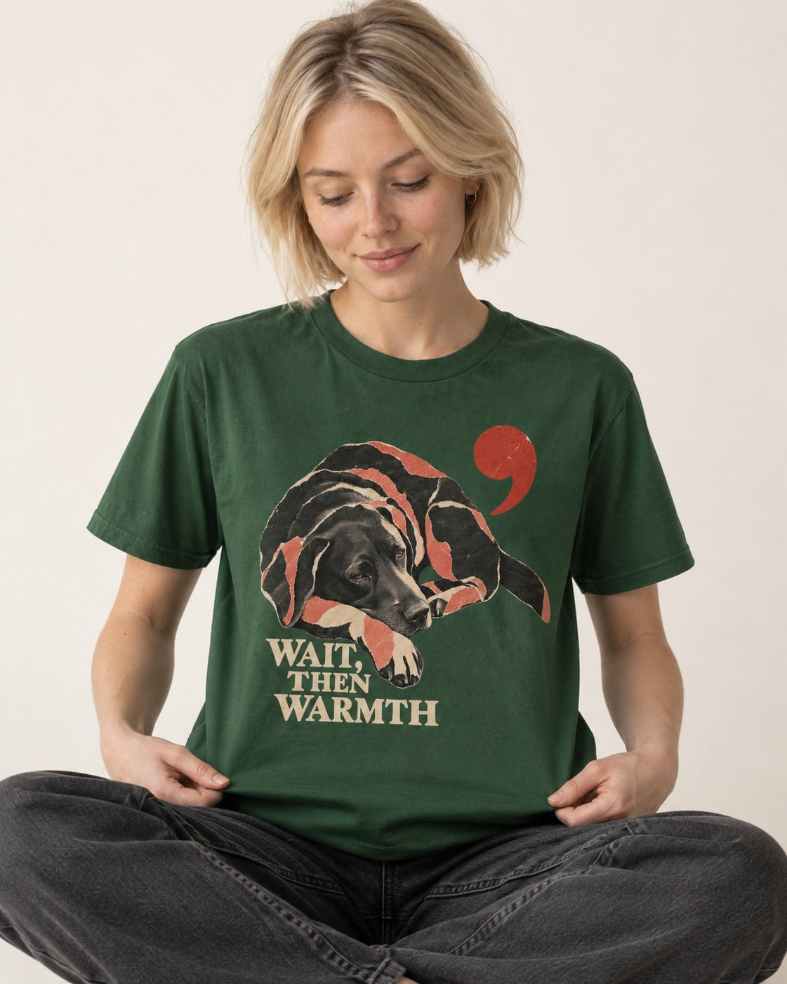 Labrador Retriever Wait Then Warmth Blanket Pause Graphic T-Shirt in Forest Green, worn by a seated model