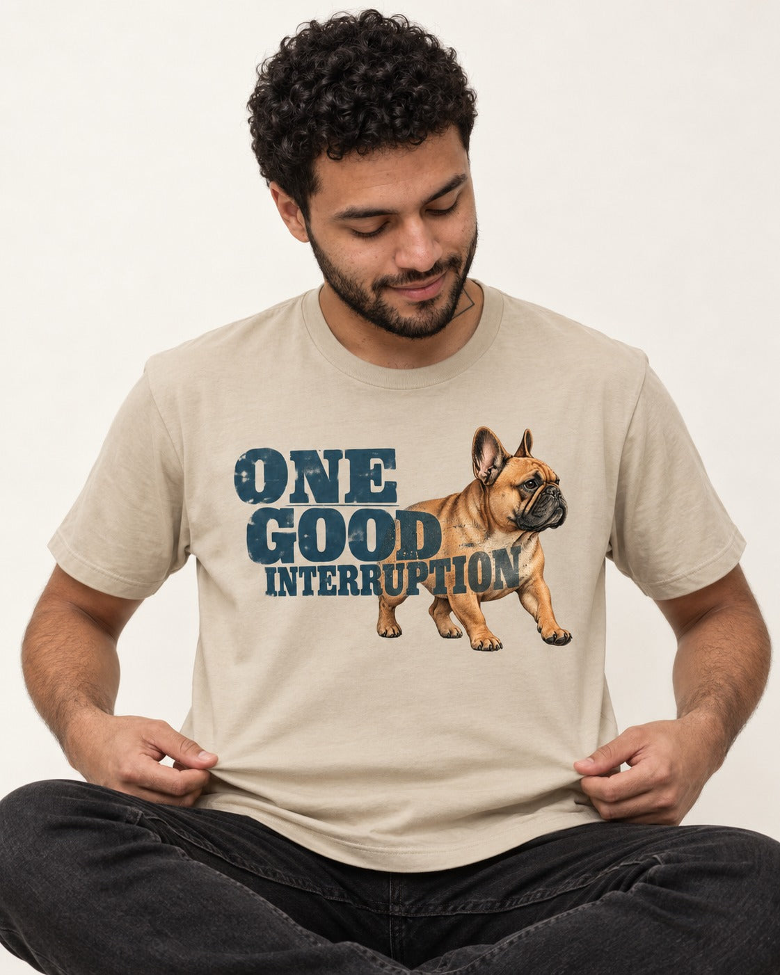 One Good Frenchie Interruption T-Shirt in Sand, worn by a seated model